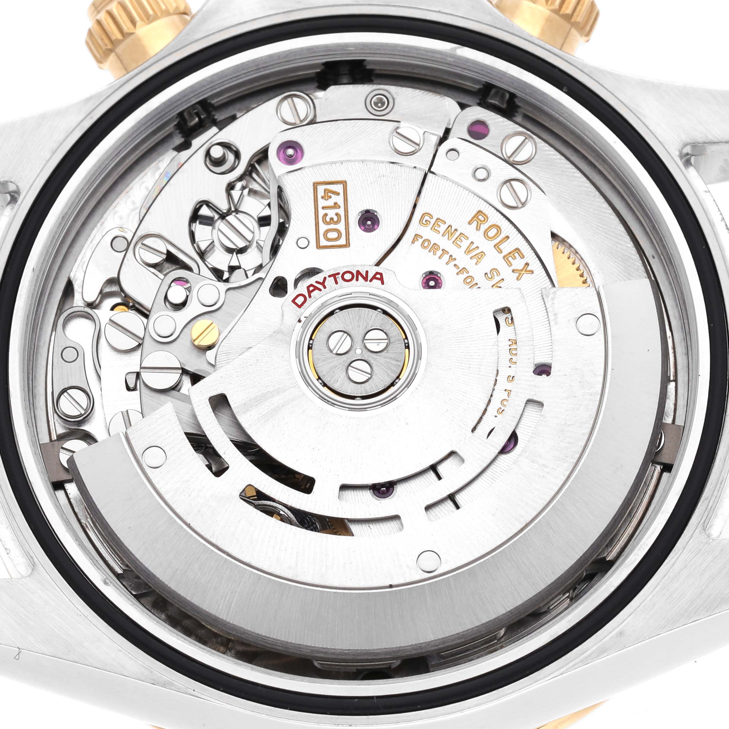 The image shows the movement of a Rolex Daytona 116503 Men's Steel and Gold (two tone) Mother of Pearl Dial 116503 Men's Steel and Gold (two tone) Mother of Pearl Dial watch, focusing on the intricate mechanisms inside.