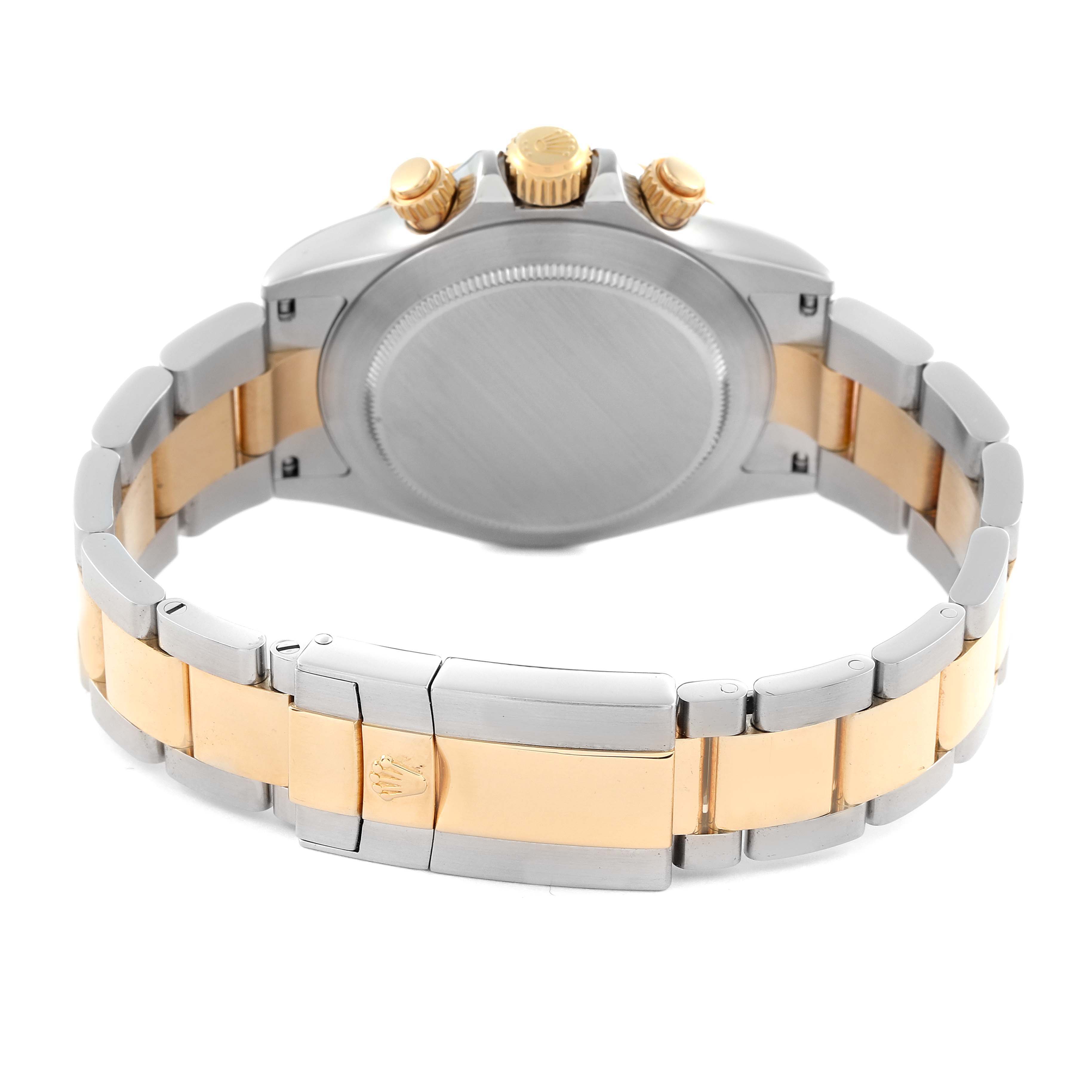 The image shows the back of the Rolex Daytona 116523 Men's Steel and Gold (two tone) Silver Dial 116523 Men's Steel and Gold (two tone) Silver Dial, featuring its case, bracelet, and clasp from a rear angle.