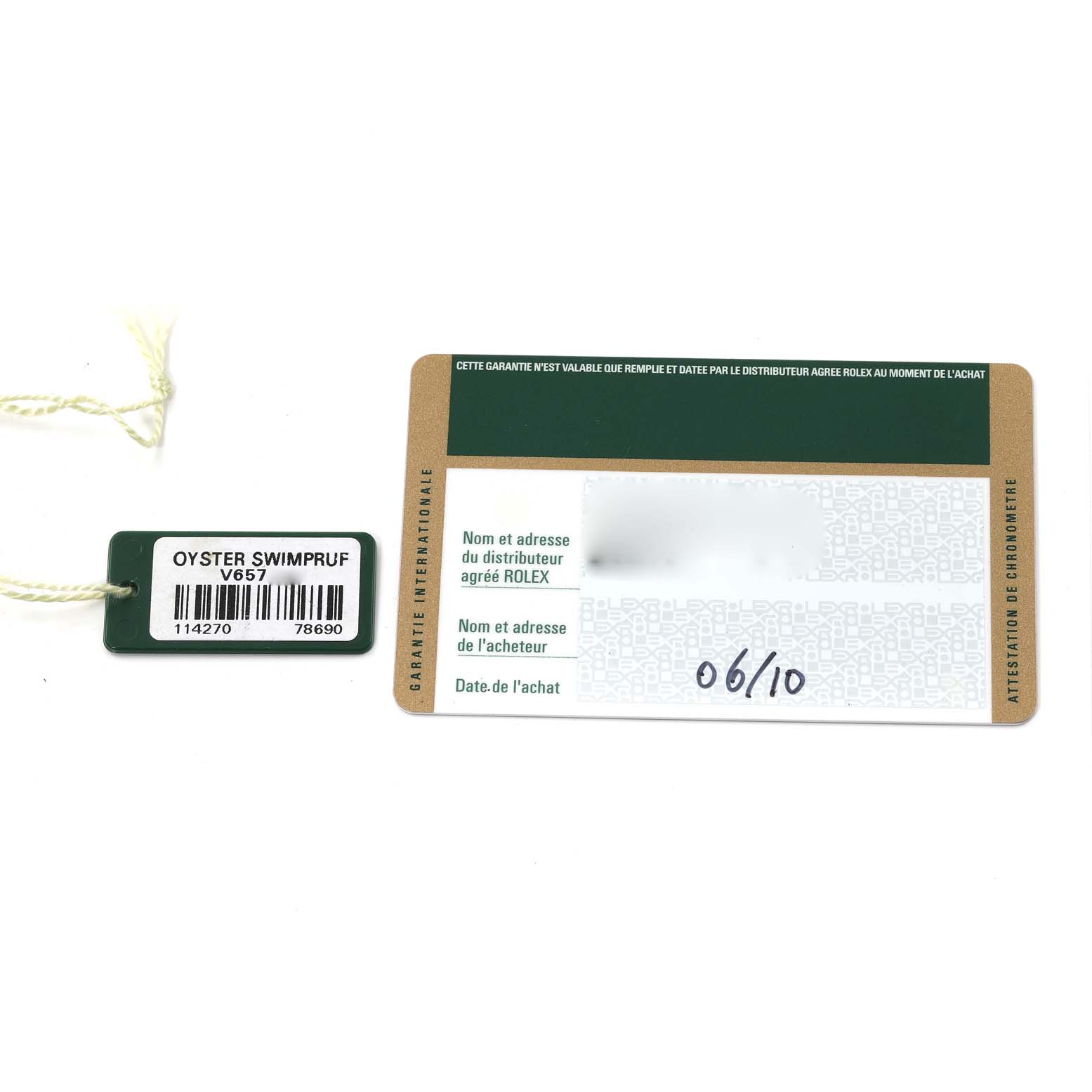 The image shows a warranty card and a hang tag for the Rolex Explorer 114270 Men
s Stainless Steel Black Dial 114270 Men
s Stainless Steel Black Dial model.