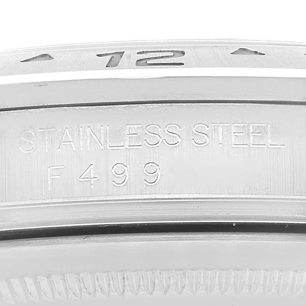 This image shows a close-up of the bezel and case of a Rolex Explorer 16570 Men
s Stainless Steel White Dial 16570 Men
s Stainless Steel White Dial watch, focusing on the stainless steel engraving and serial number.