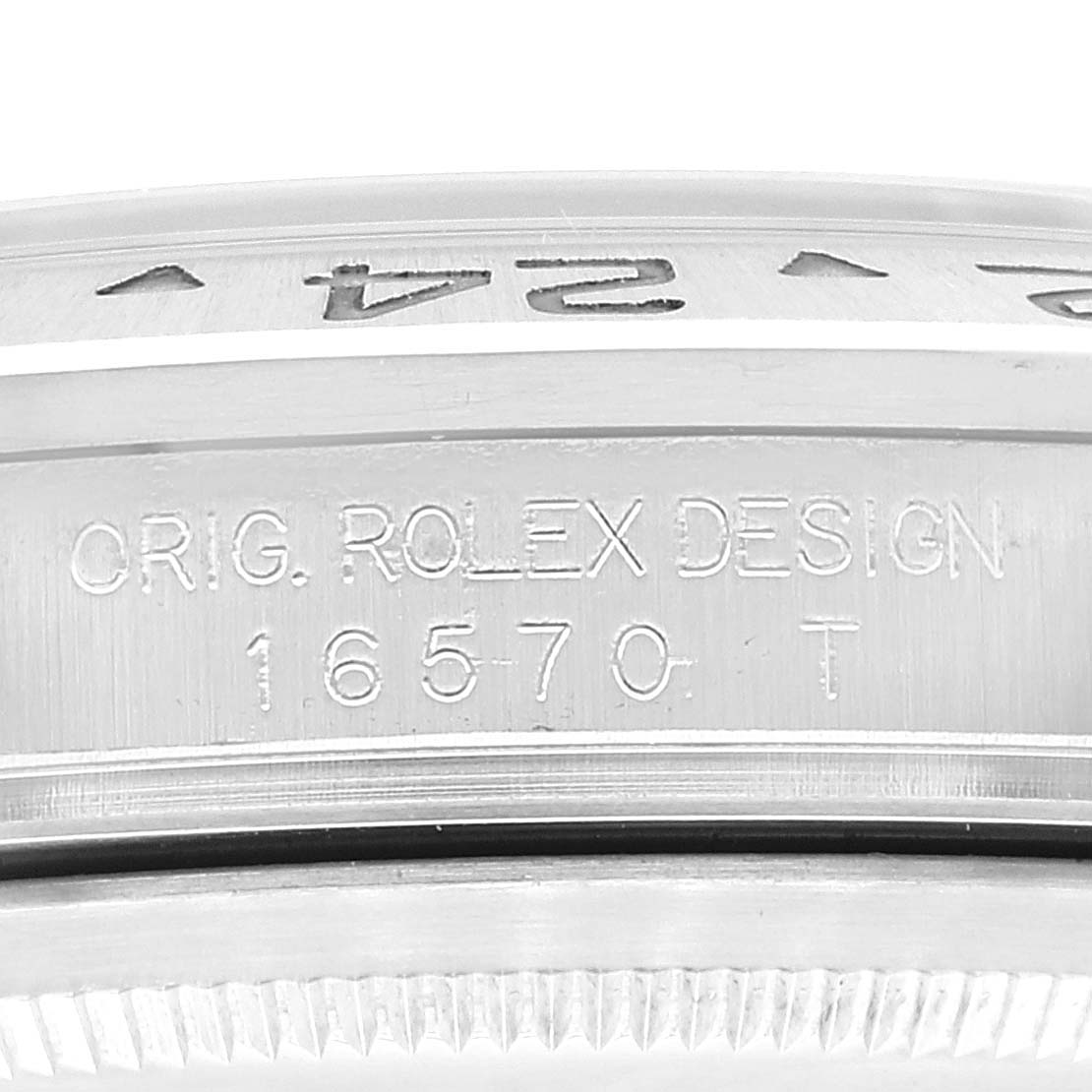 The image shows a close-up of the bezel and casing of a Rolex Explorer 16570 Men
s Stainless Steel White Dial 16570 Men
s Stainless Steel White Dial model, highlighting the engraved model number.