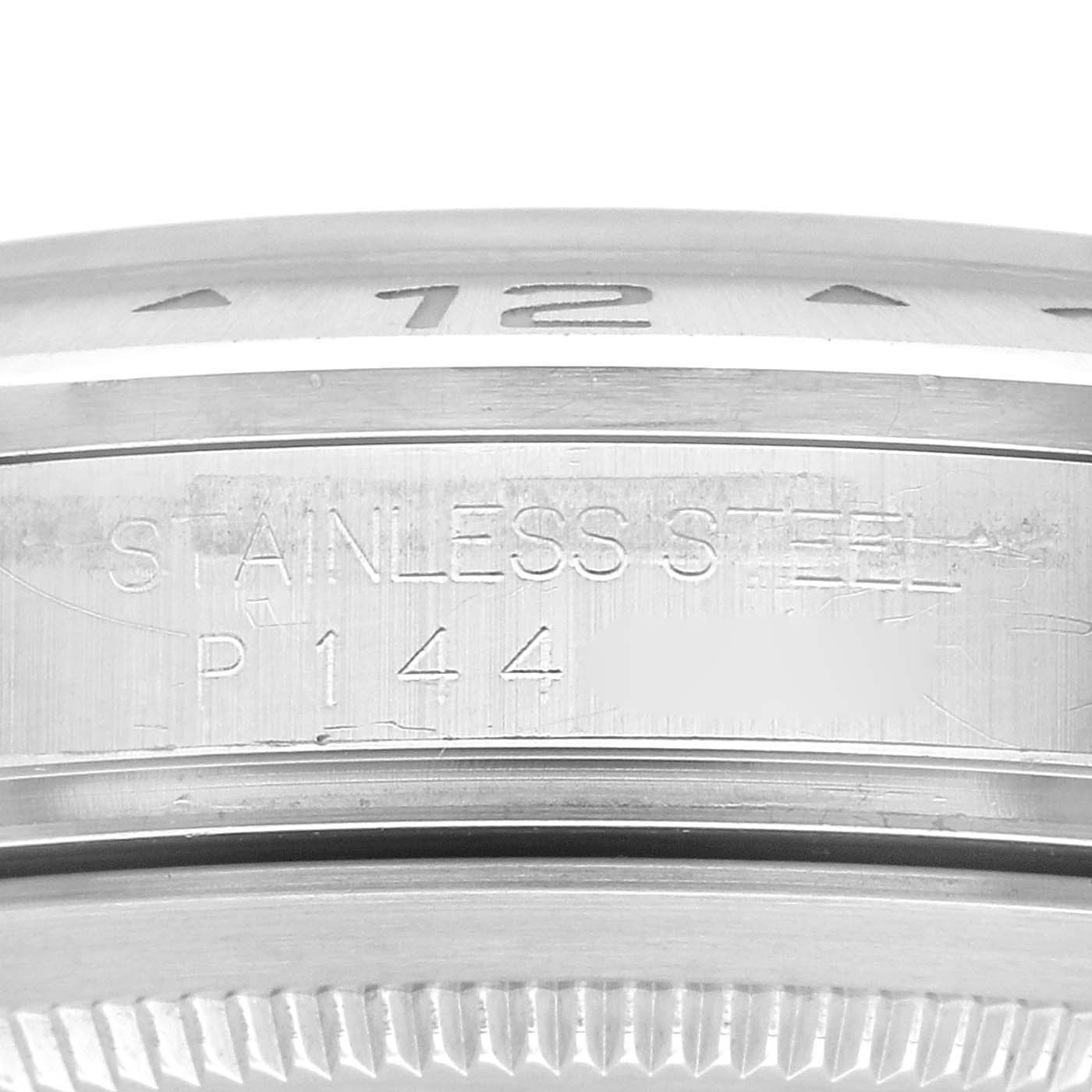 This image shows a close-up view of the side of a Rolex Explorer 16570 Men's Stainless Steel White Dial 16570 Men's Stainless Steel White Dial model stainless steel case with engravings.