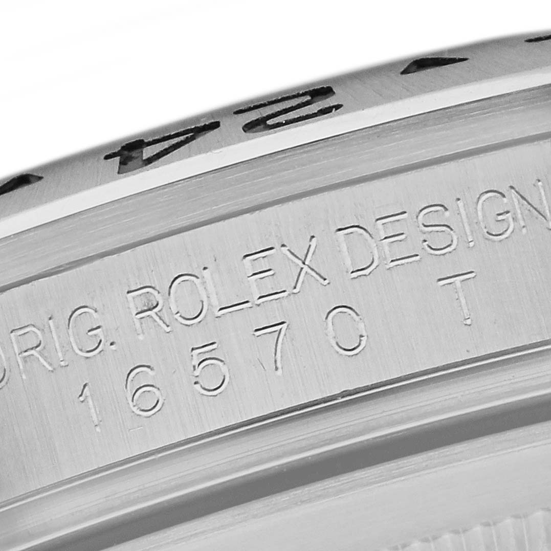 The image shows a close-up of the engraved side of the bezel and case of a Rolex Explorer 16570 Men's Stainless Steel White Dial 16570 Men's Stainless Steel White Dial watch model 16570.