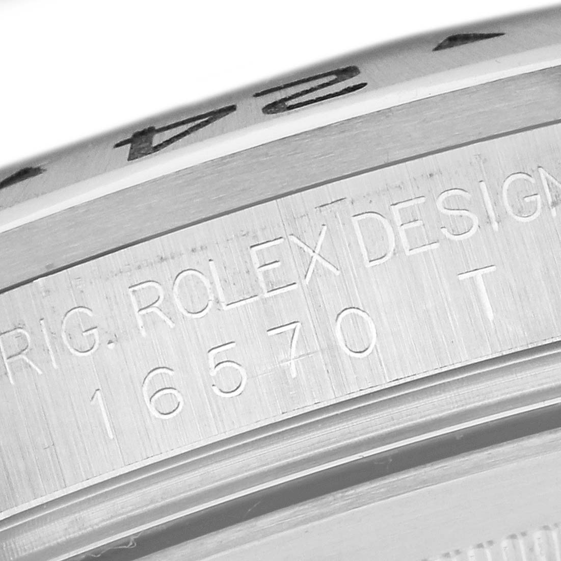 The image shows a close-up of the case side of a Rolex Explorer 16570 Men's Stainless Steel White Dial 16570 Men's Stainless Steel White Dial watch, featuring the model number 16570.