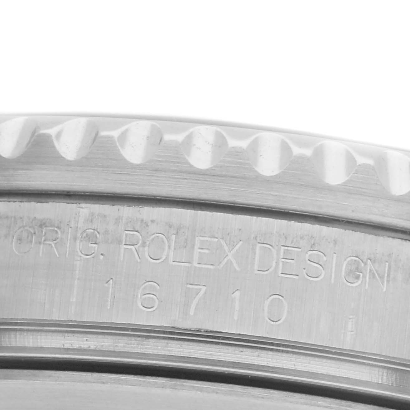 The image shows a close-up of the side casing of the Rolex GMT-Master 16710 Men's Stainless Steel Black Dial 16710 Men's Stainless Steel Black Dial model, highlighting the model engraving and bezel edge.