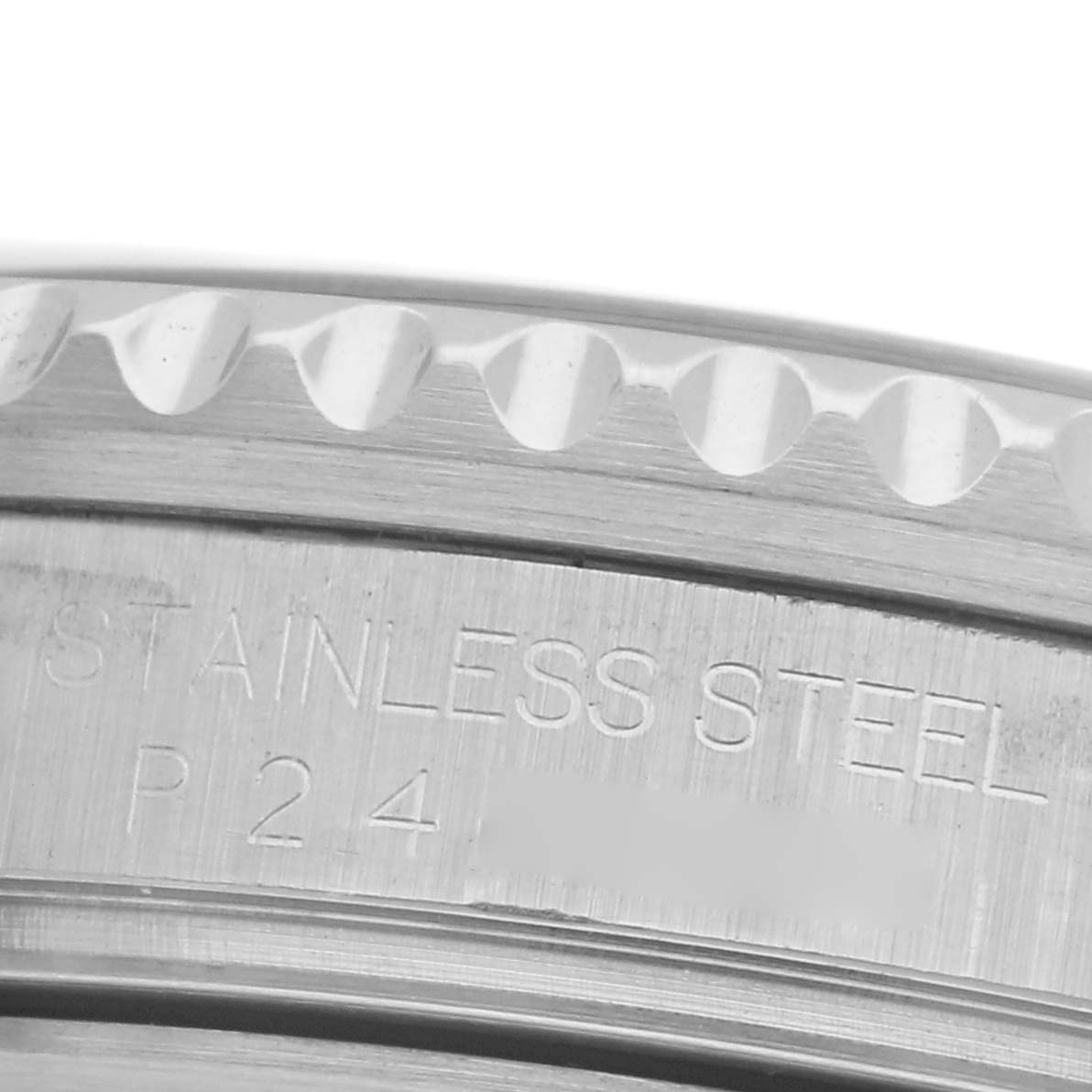 The image shows a close-up of the edge and engraved detail of a Rolex GMT-Master 16710 Men's Stainless Steel Black Dial 16710 Men's Stainless Steel Black Dial's stainless steel case.