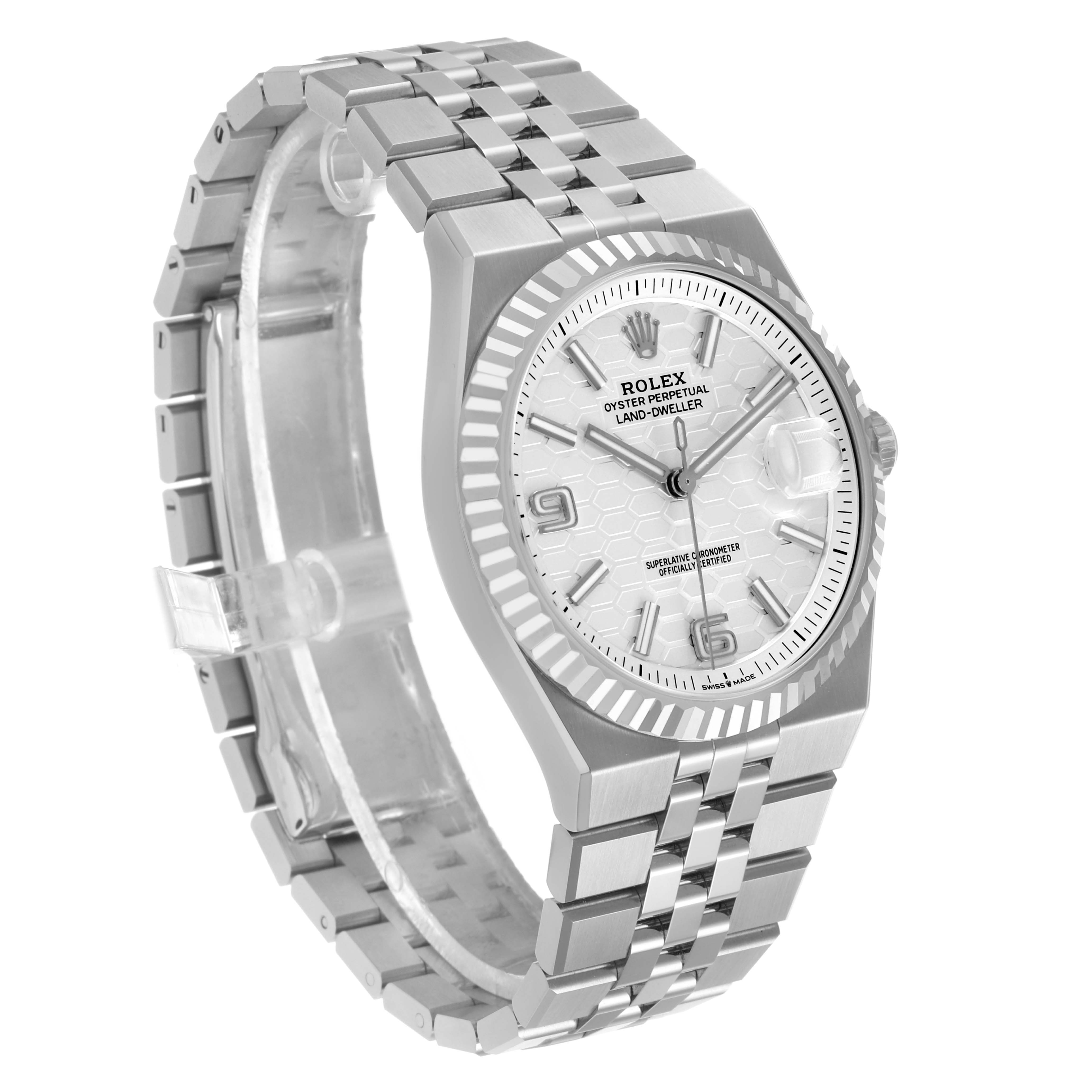 The Rolex Land‑Dweller 127334 Men's Stainless Steel White Dial watch is shown at a front-left angle, displaying its bezel, dial, and bracelet.