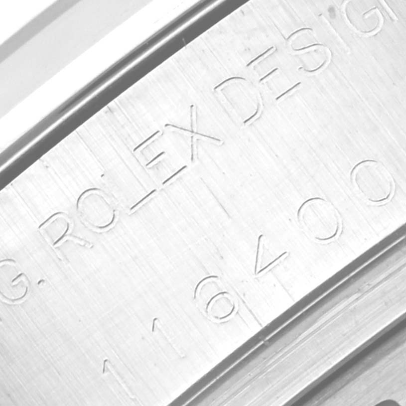 This close-up image shows the engraved serial number and "ROLEX DESIGN" text on the side of the Rolex Milgauss 116400 Men's Stainless Steel Black Dial 116400 Men's Stainless Steel Black Dial model.