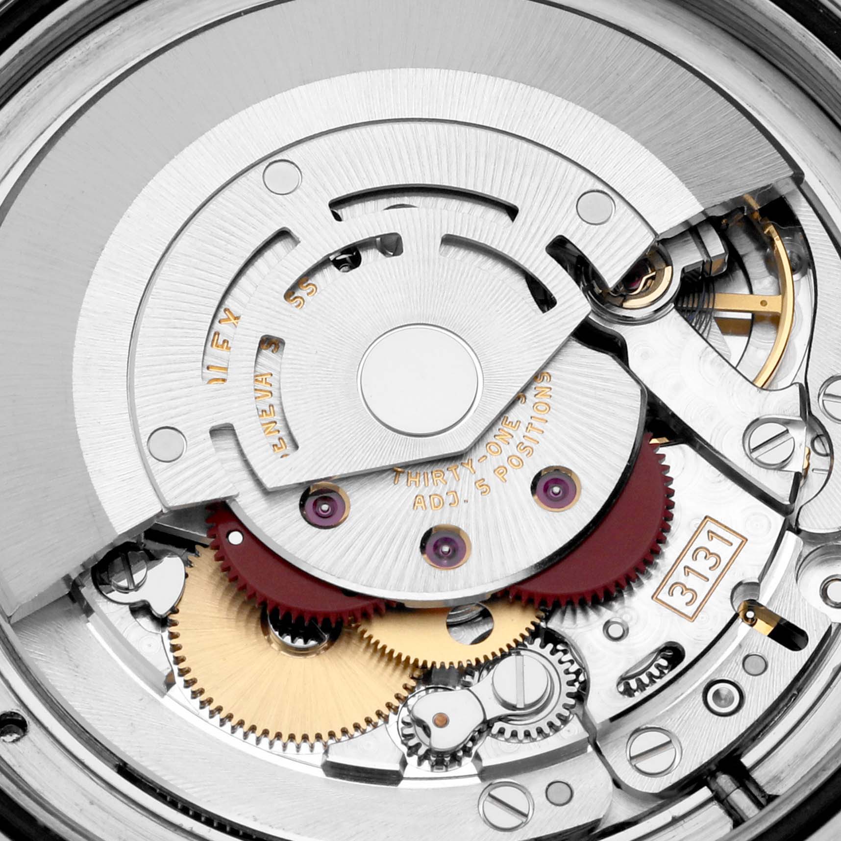 This image shows the movement mechanism of a Rolex Milgauss 116400 Men's Stainless Steel Black Dial 116400 Men's Stainless Steel Black Dial, including gears, jewels, and the rotor.