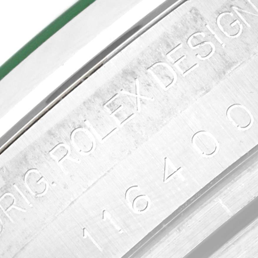 This close-up image shows the engraved text "ROLEX DESIGN" and the model number "116400" on the side of a Rolex Milgauss 116400GV Men's Stainless Steel Blue Dial 116400GV Men's Stainless Steel Blue Dial watch case.
