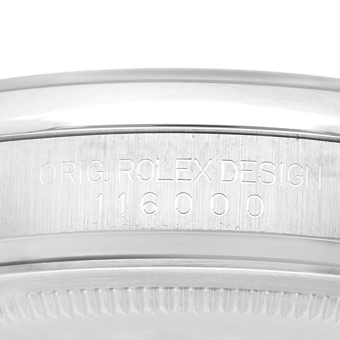 This image shows a close-up of the side of a Rolex Oyster Perpetual 116000 Men
s Stainless Steel Black Dial 116000 Men
s Stainless Steel Black Dial watch with the model number 116000 engraved.