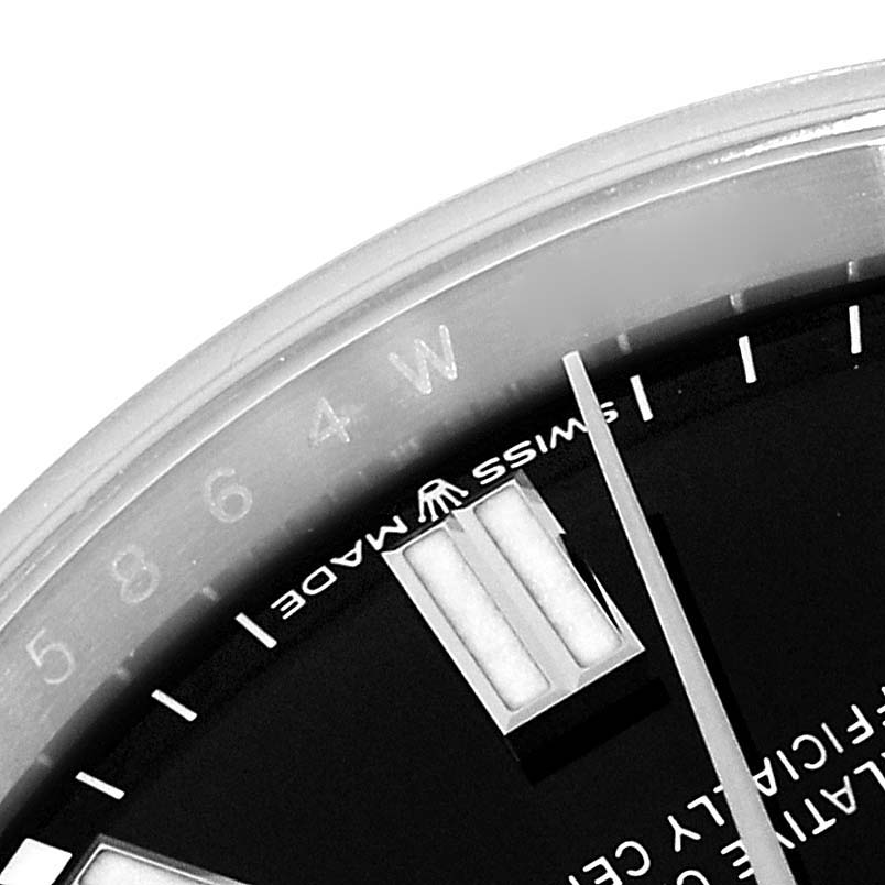 The image shows a close-up angle of the dial and minute markers of a Rolex Oyster Perpetual 126000 Men
s Stainless Steel Black Dial 126000 Men
s Stainless Steel Black Dial watch.