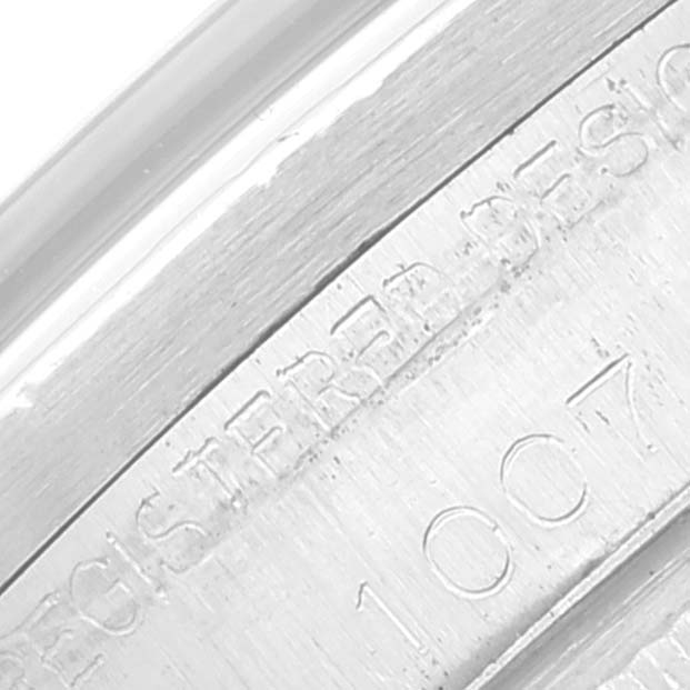 This image shows a close-up angle of the serial number engraving on the case of a Vintage Collection model by Rolex.