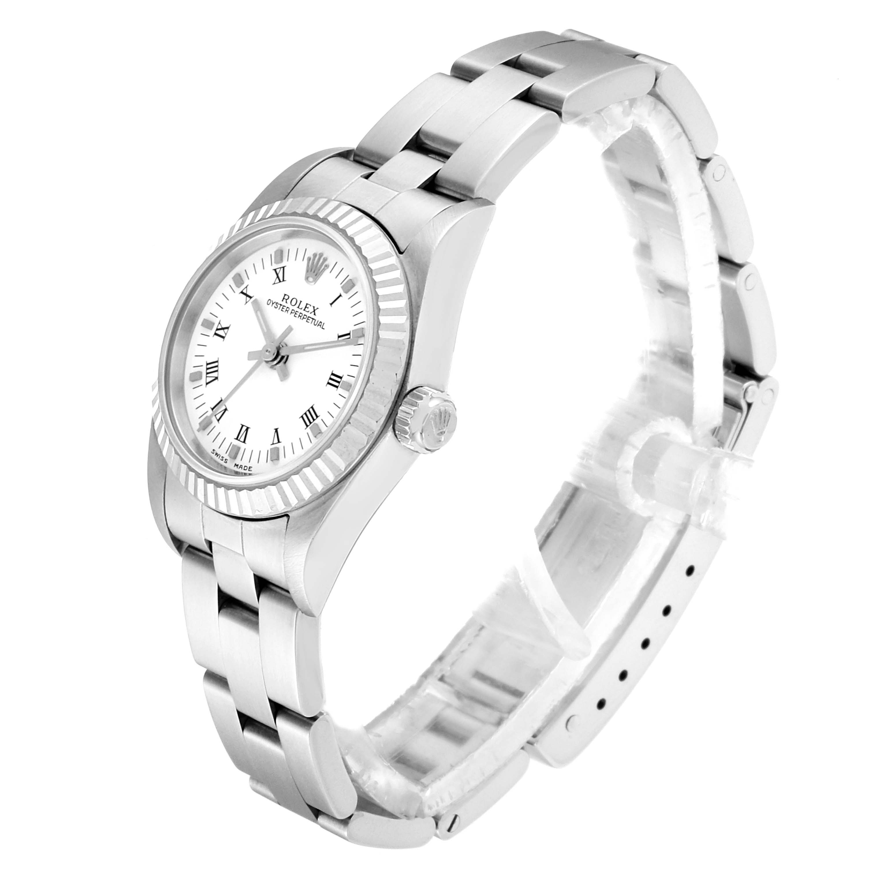 The image shows a side and top angle of a Rolex Oyster Perpetual 76094 Women
s Stainless Steel White Dial 76094 Women
s Stainless Steel White Dial watch, displaying its dial, bezel, case, and bracelet.