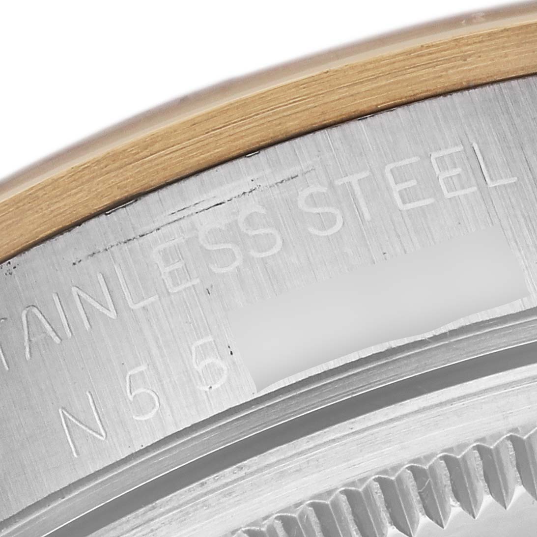 The image shows a close-up of the stainless steel case back of a Rolex Oyster Perpetual 14203 Men's Steel and Gold (two tone) Grey Dial 14203 Men's Steel and Gold (two tone) Grey Dial watch.