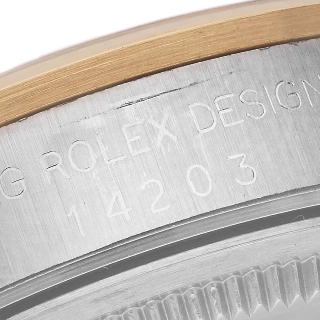 A close-up angle showing the engraved serial number and markings on the side of the Rolex Oyster Perpetual 14203 Men's Steel and Gold (two tone) Grey Dial 14203 Men's Steel and Gold (two tone) Grey Dial model 14203.