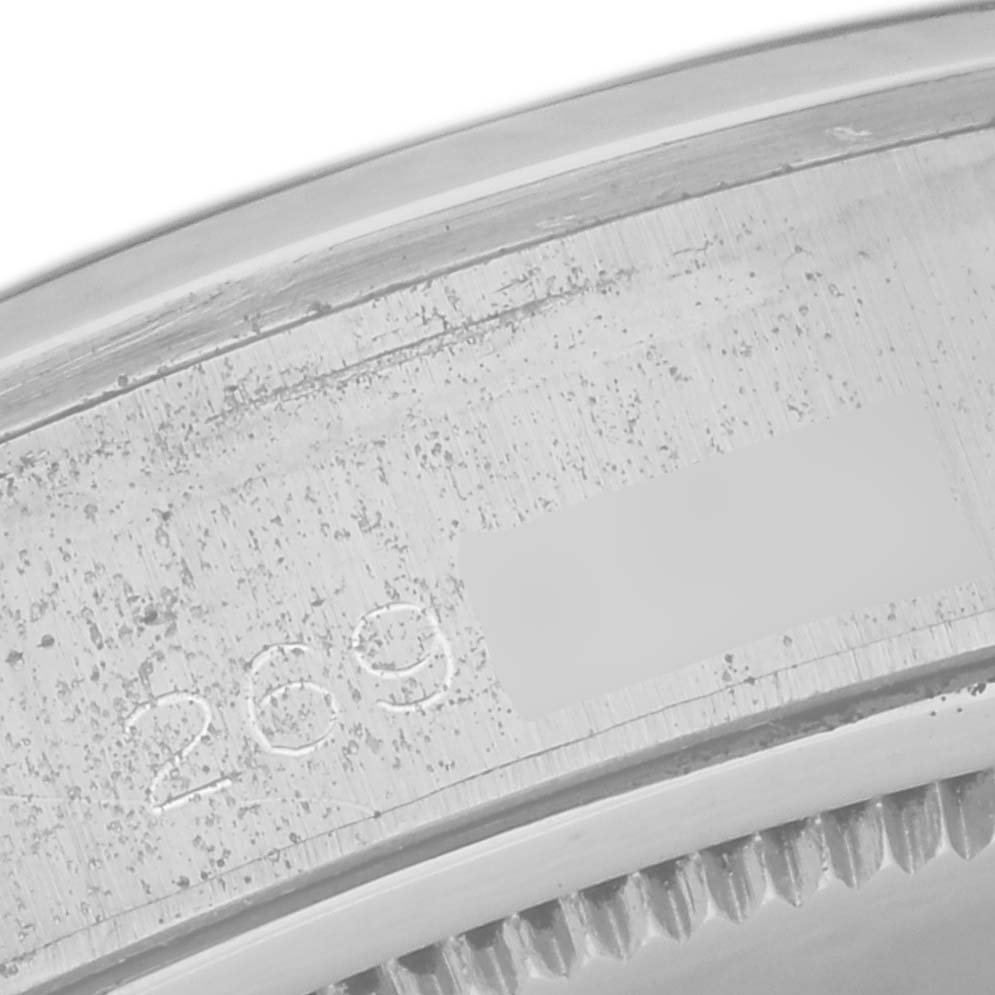 The image shows a close-up of the serial number engraved on the case of a Rolex Vintage Collection 6694 Men's Stainless Steel Silver Dial 6694 Men's Stainless Steel Silver Dial model watch.