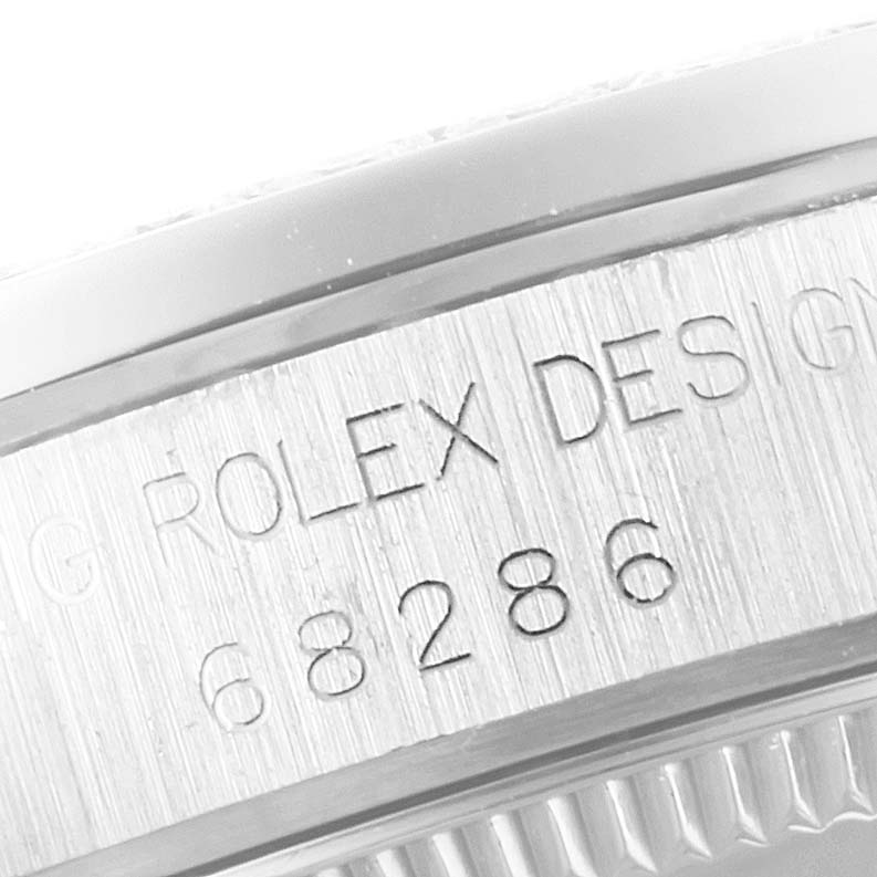 This close-up image shows the case engraving on a Rolex President 68286 Women
s Platinum Silver Dial 68286 Women
s Platinum Silver Dial model watch.