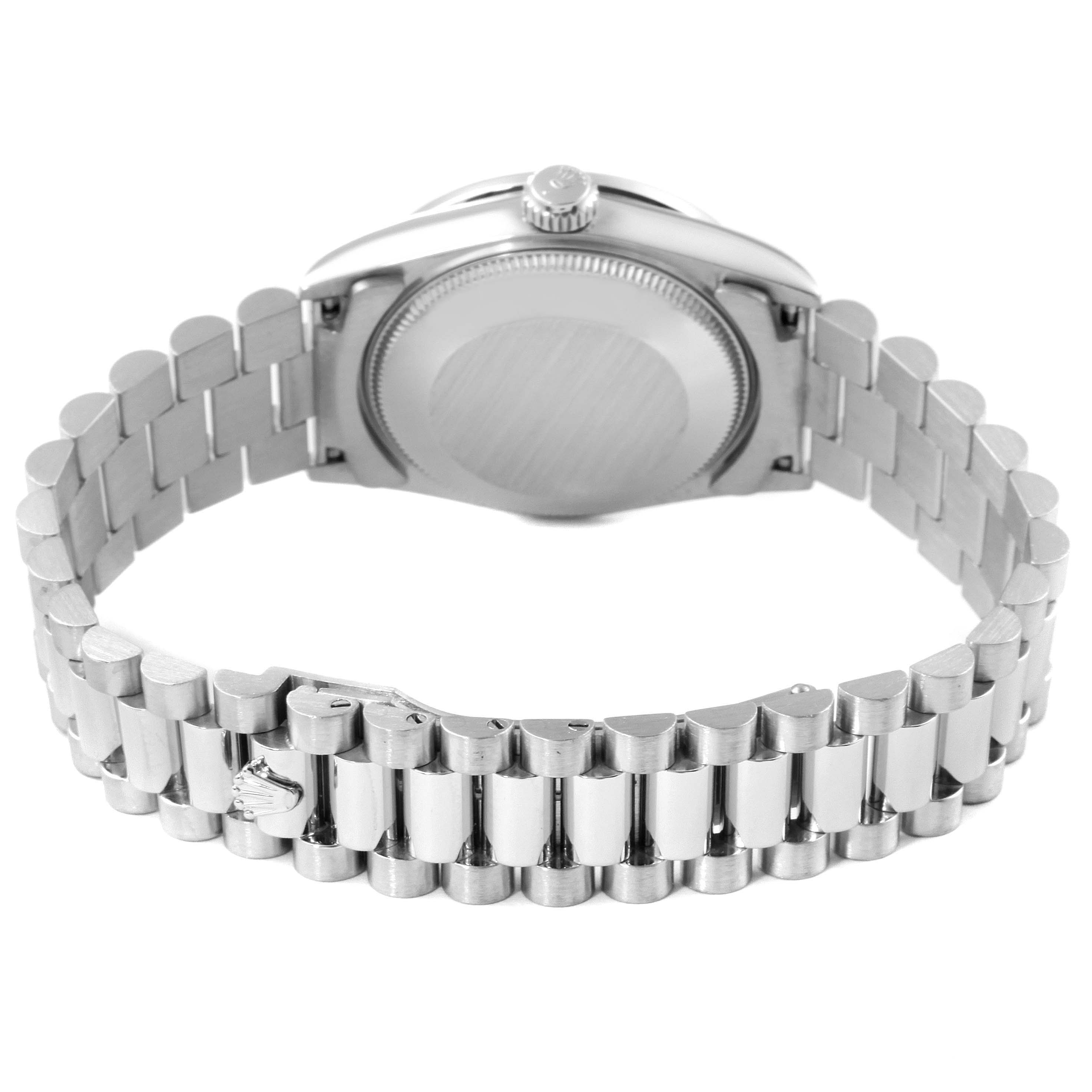 This image shows the back of the Rolex President 68286 Women
s Platinum Silver Dial 68286 Women
s Platinum Silver Dial watch and its metal bracelet from a rear angle.