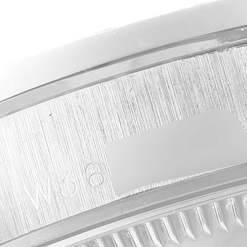 The image shows a close-up of the engraved inner bezel of a Rolex President 68286 Women
s Platinum Silver Dial 68286 Women
s Platinum Silver Dial model watch.