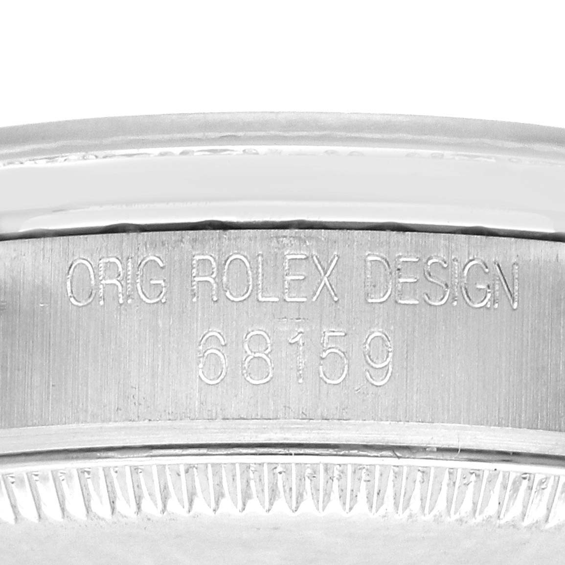The image shows the side engraving of the Rolex President 68159G Women's White Gold Silver Dial 68159G Women's White Gold Silver Dial model, displaying "ORIG ROLEX DESIGN" and the model number.