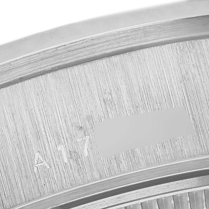The image shows a close-up of the inner case area of a Rolex Datejust 69166 Women's Platinum Mother of Pearl Dial 69166 Women's Platinum Mother of Pearl Dial watch with visible engravings.