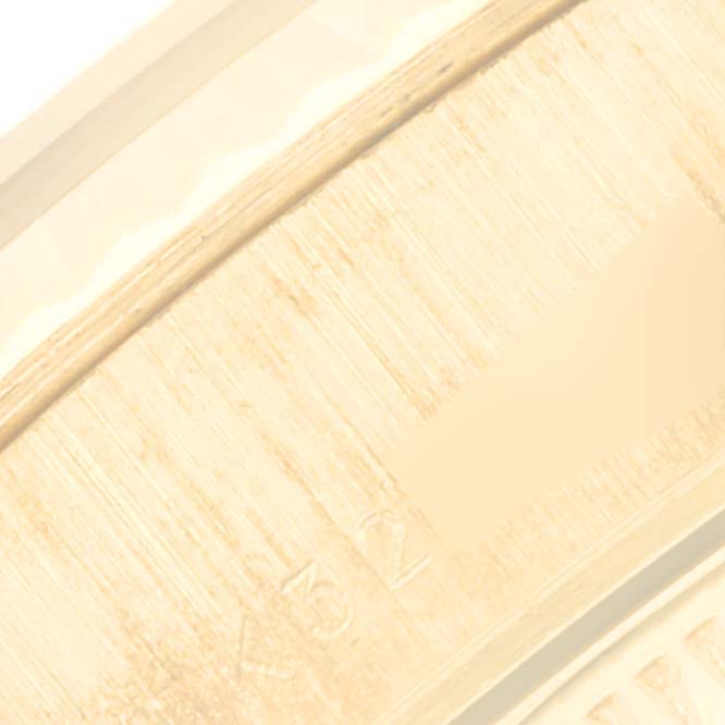 This close-up image focuses on the clasp mechanism of the Rolex President 79178 Women
s Yellow Gold Champagne Dial 79178 Women
s Yellow Gold Champagne Dial watch.