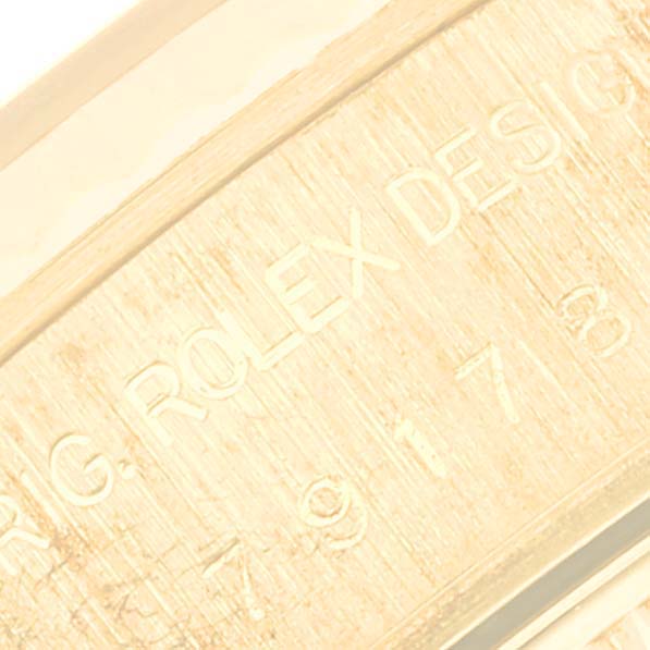 The close-up image shows the engraved inner rim of the bezel for the Rolex President 79178 Women
s Yellow Gold Champagne Dial 79178 Women
s Yellow Gold Champagne Dial model.