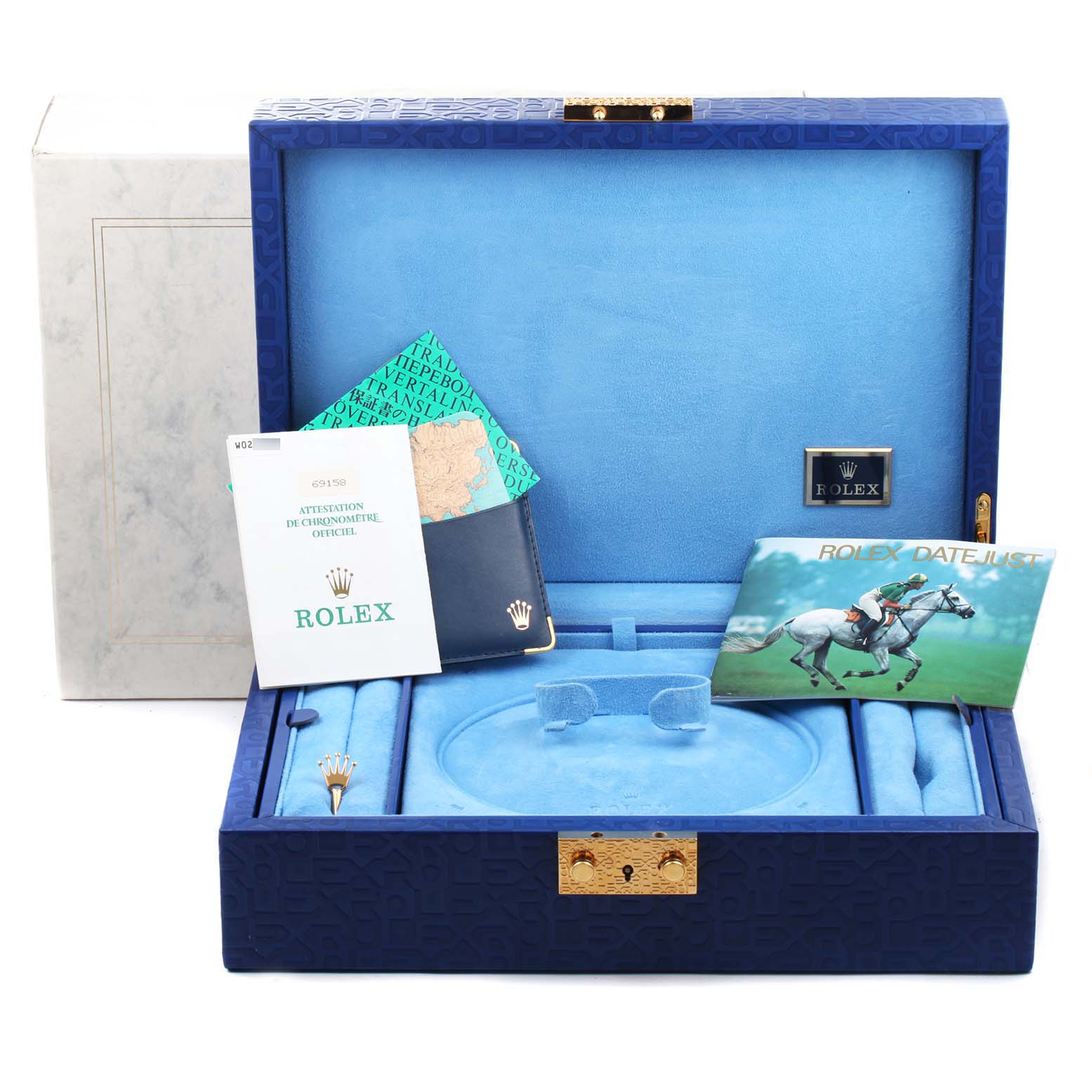 The image shows the open box, certificates, and booklets of a Rolex President 69158 Women
s Yellow Gold Black Dial 69158 Women
s Yellow Gold Black Dial model watch from a front angle.