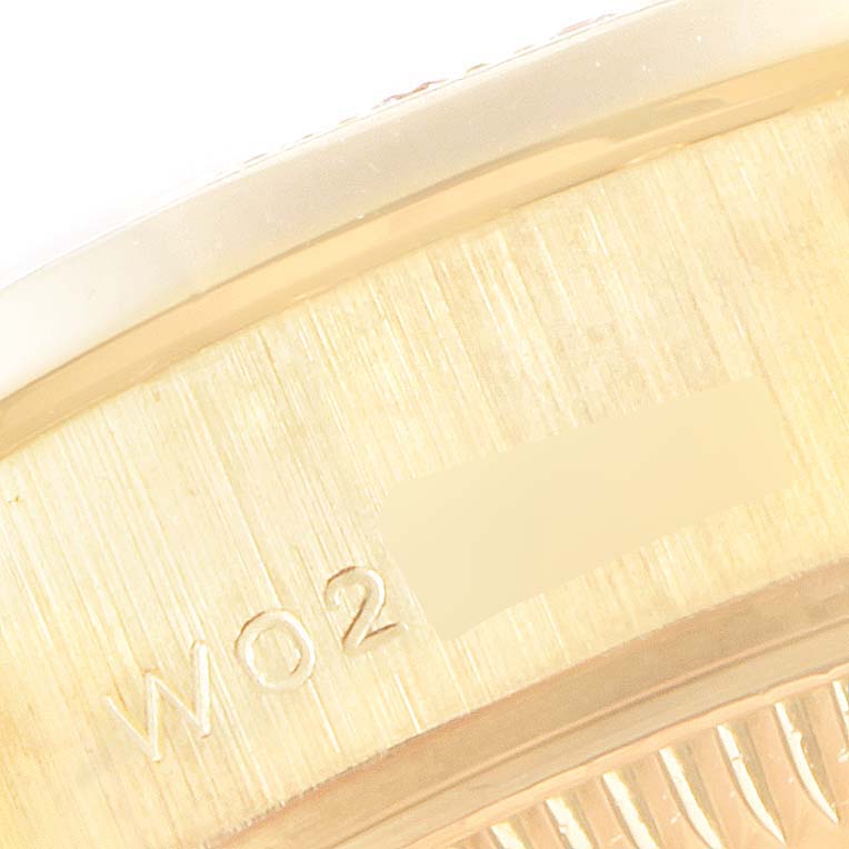 Close-up of the engraving on the side of the Rolex President 69158 Women
s Yellow Gold Black Dial 69158 Women
s Yellow Gold Black Dial model watch case.