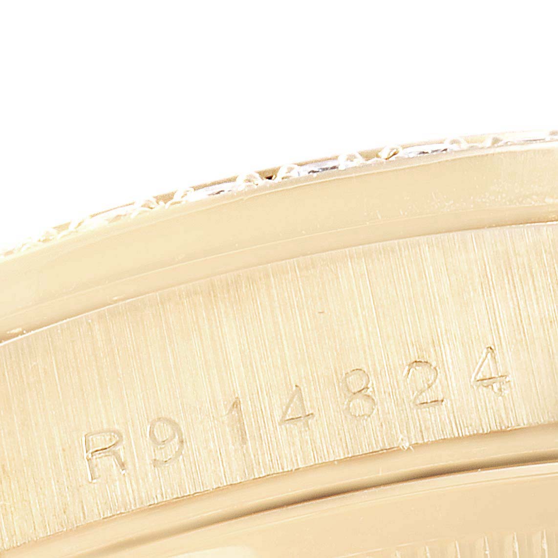 This close-up image shows the serial number engraving on the case of a Rolex President 18348 Men
s Yellow Gold Champagne Dial 18348 Men
s Yellow Gold Champagne Dial model watch.