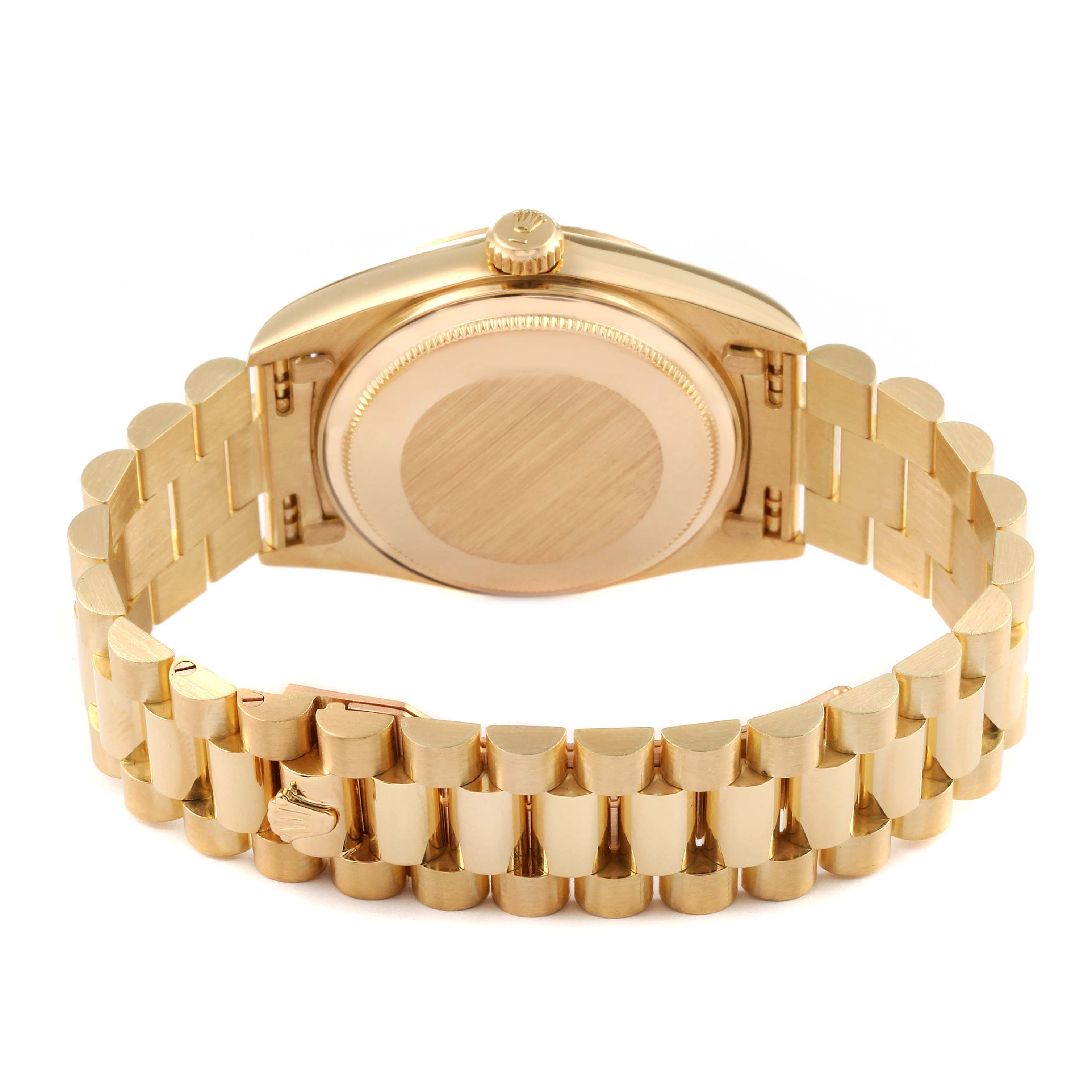 This image shows the back case and band of a Rolex President 18038 Men
s Yellow Gold Champagne Dial 18038 Men
s Yellow Gold Champagne Dial model watch in a slightly tilted angle.