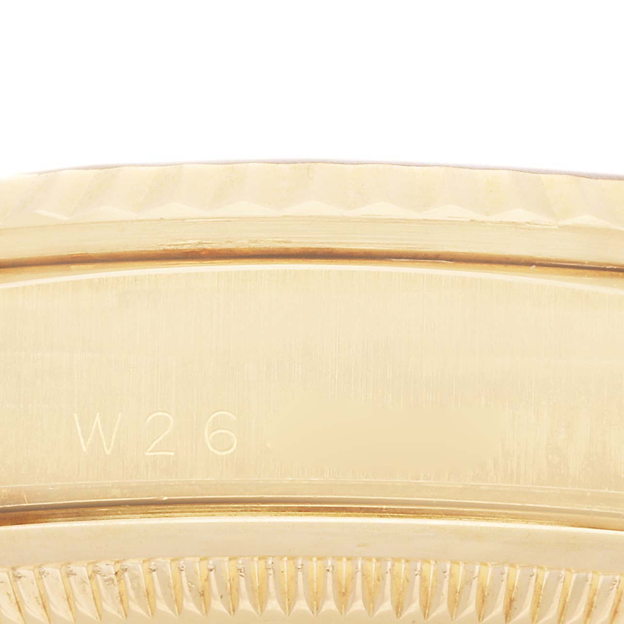 This image shows a close-up of the case back and serial-end area on a Rolex President 18238 Men
s Yellow Gold Champagne Dial 18238 Men
s Yellow Gold Champagne Dial watch, highlighting the serial engraving.