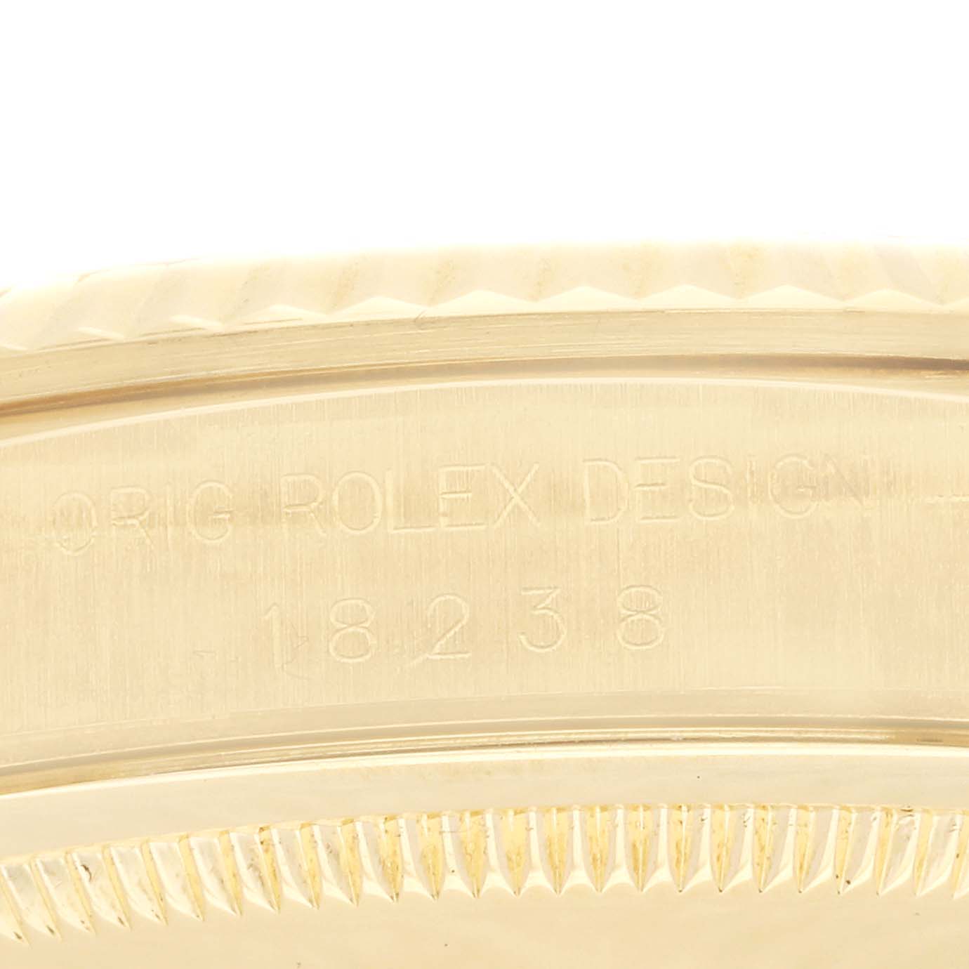 This close-up image shows the side view of the case back engraving of a Rolex President 18238 Men
s Yellow Gold Champagne Dial 18238 Men
s Yellow Gold Champagne Dial model, displaying the model number.