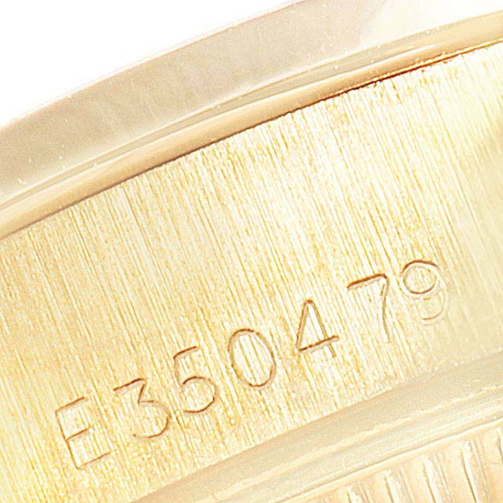 The image shows a close-up of the serial number on the case of a Rolex President 69068 Women
s Yellow Gold Mother of Pearl Dial 69068 Women
s Yellow Gold Mother of Pearl Dial model watch.