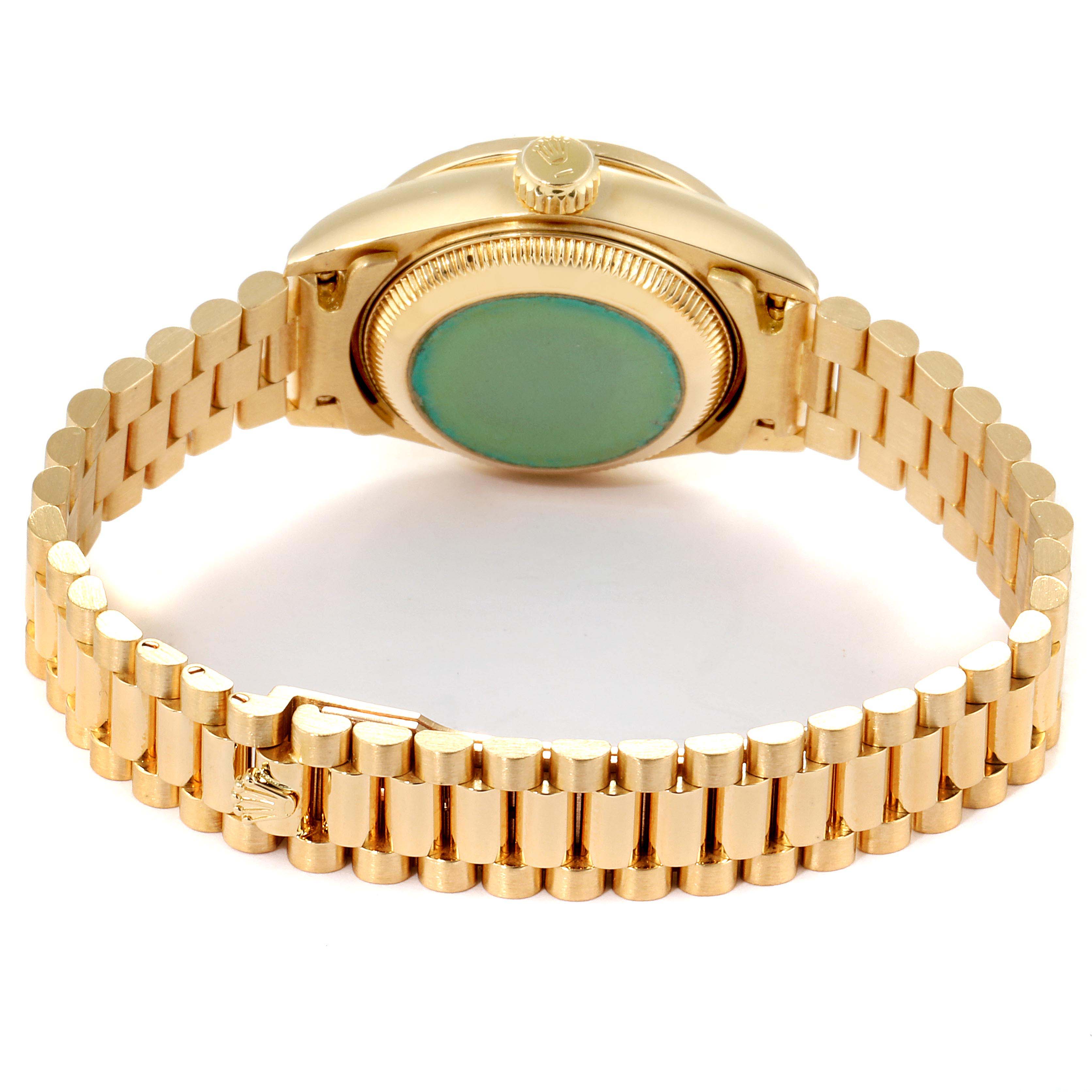 This image shows the back case and bracelet of a Rolex President 69068 Women
s Yellow Gold Mother of Pearl Dial 69068 Women
s Yellow Gold Mother of Pearl Dial model watch viewed from the back.