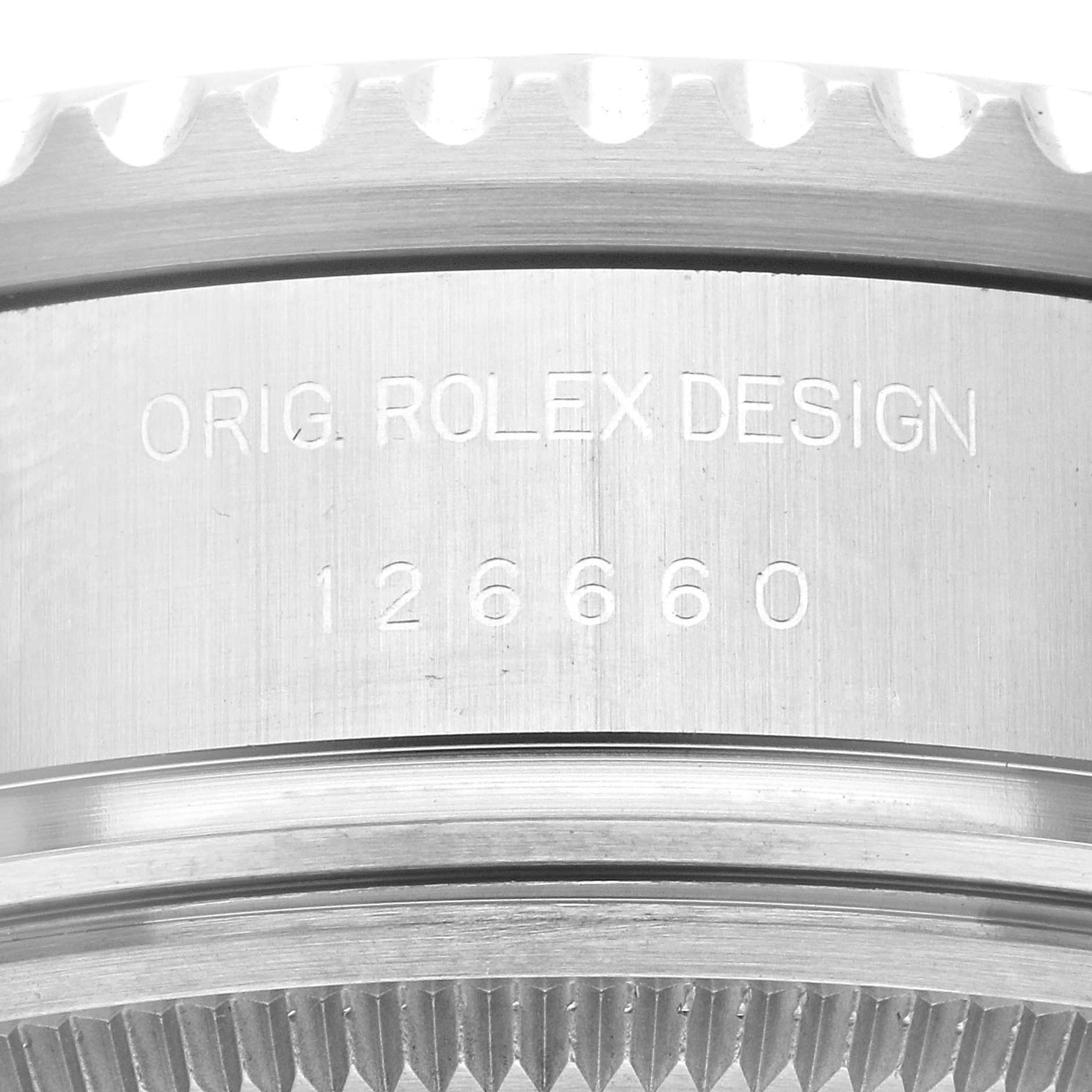 The image shows the side view of the bezel and case with the engraving "ORIG. ROLEX DESIGN 126660" of the Rolex Sea-Dweller 126660 Men's Stainless Steel Blue Dial 126660 Men's Stainless Steel Blue Dial.