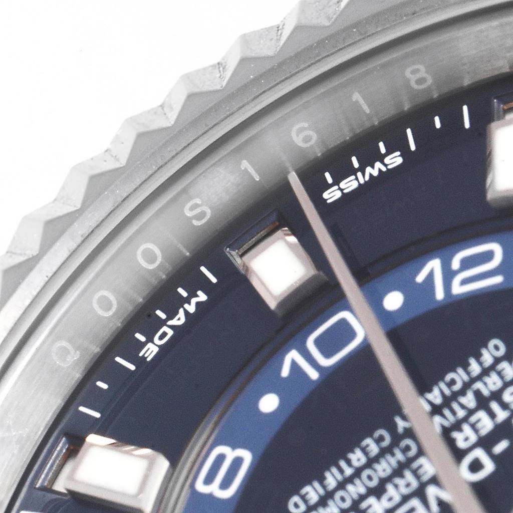 The image shows a close-up of the dial and bezel on a Rolex Sky-Dweller 326934 Men's Stainless Steel Blue Dial 326934 Men's Stainless Steel Blue Dial watch, with visible hour markers and part of the minute hand.