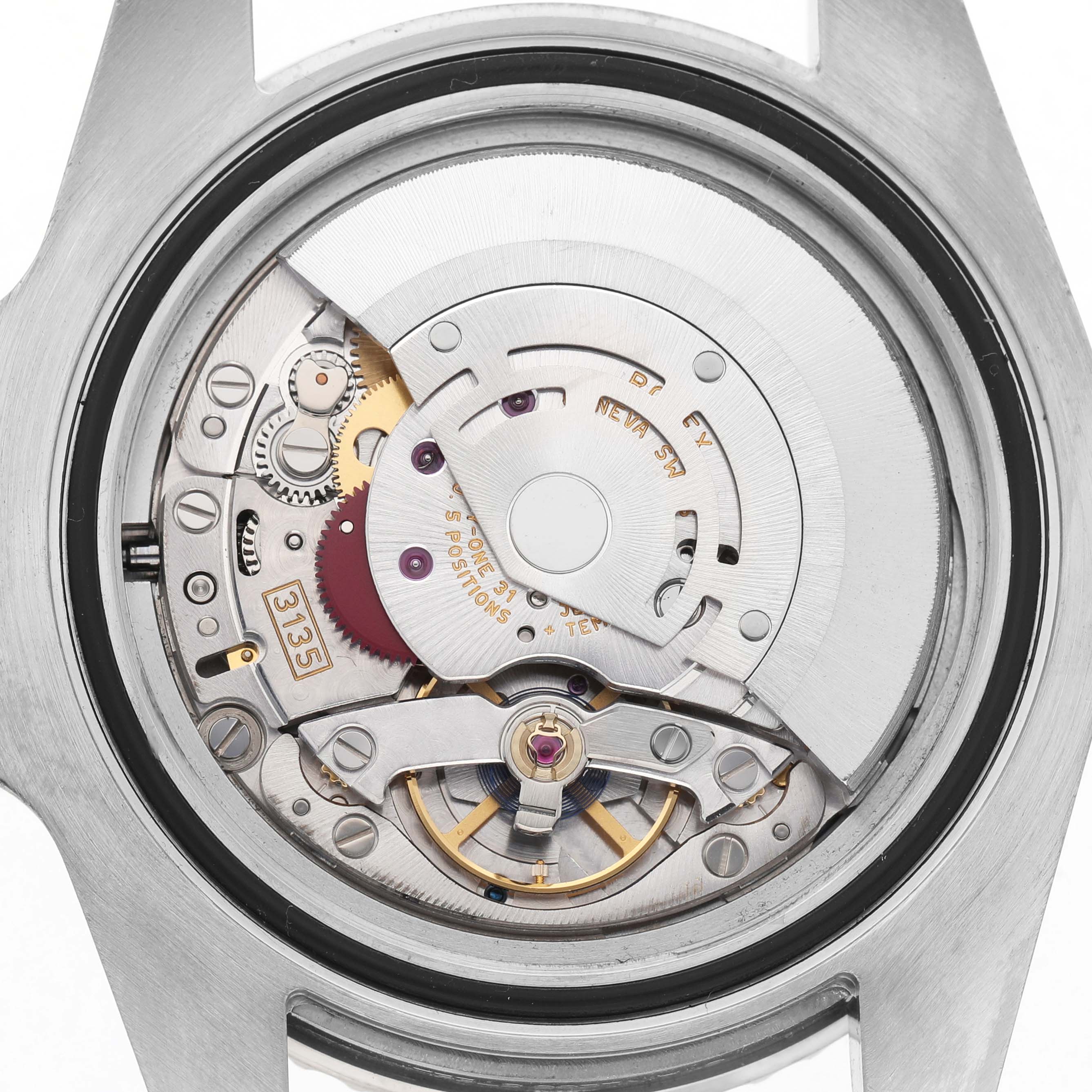 The image shows the movement of a Rolex Submariner 116610 Men's Stainless Steel Black Dial watch from the back, revealing its intricate mechanics and rotor.