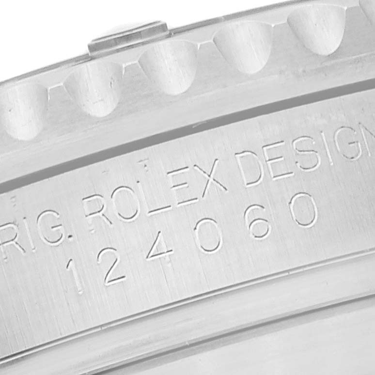 This image shows a close-up of the engravings on the side of the bezel and case of a Rolex Submariner 124060 Men
s Stainless Steel Black Dial 124060 Men
s Stainless Steel Black Dial watch.