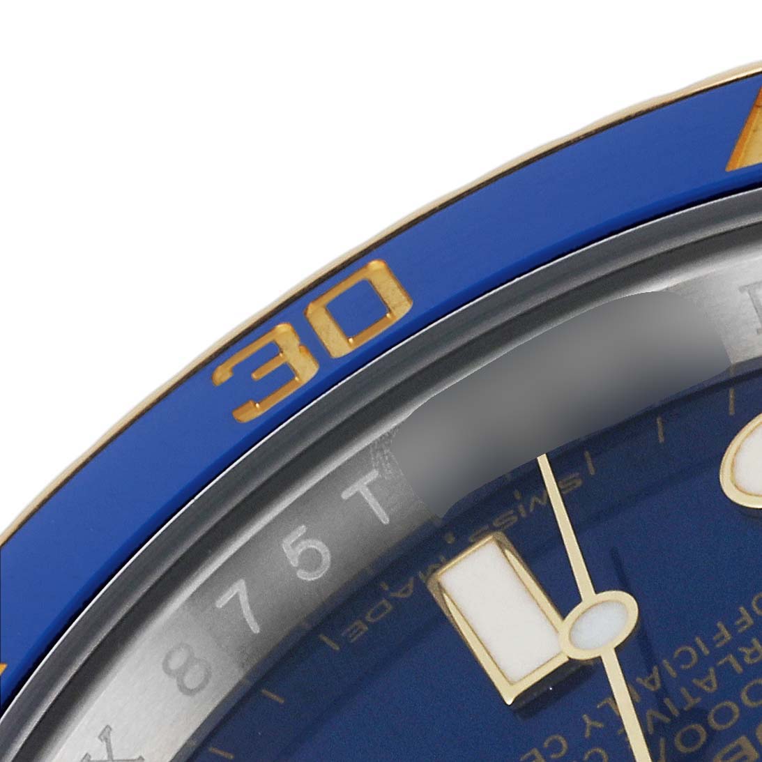 This image shows a close-up of the bezel and part of the dial of a Rolex Submariner 116613 Men's Steel and Gold (two tone) Blue Dial 116613 Men's Steel and Gold (two tone) Blue Dial watch.