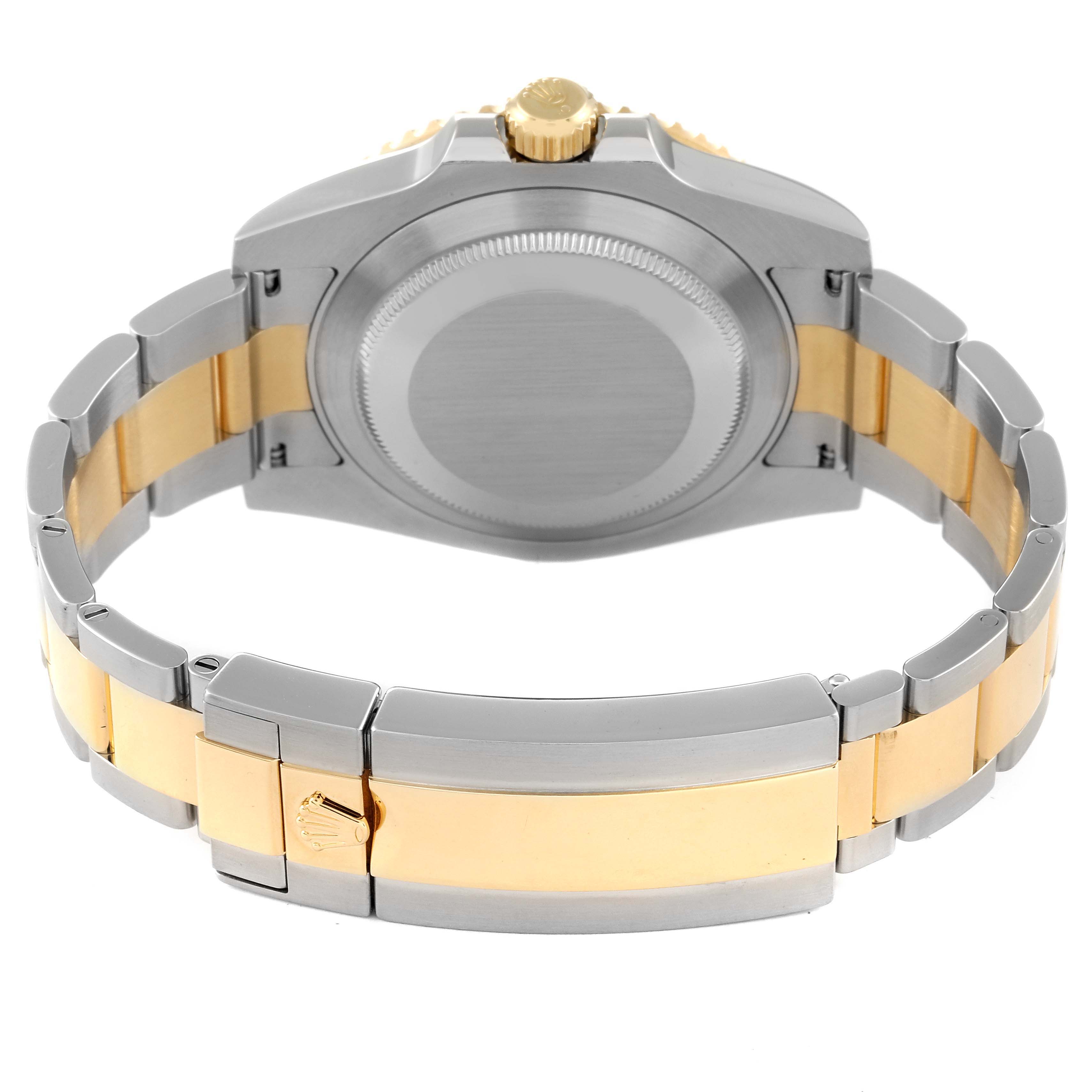 The image shows the back view of a Rolex Submariner 116613 Men's Steel and Gold (two tone) Blue Dial 116613 Men's Steel and Gold (two tone) Blue Dial watch, highlighting the case back, crown, and two-tone bracelet.