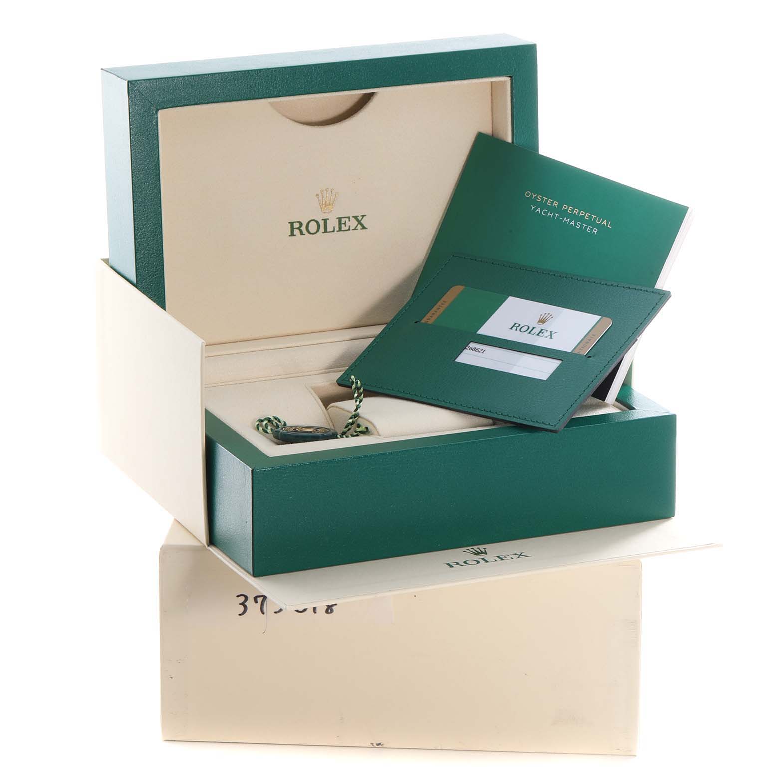 The image shows the packaging, cardholder, and accessories for a Rolex Yacht-Master 268621 Men
s Steel and Gold (two tone) Black Dial 268621 Men
s Steel and Gold (two tone) Black Dial watch.