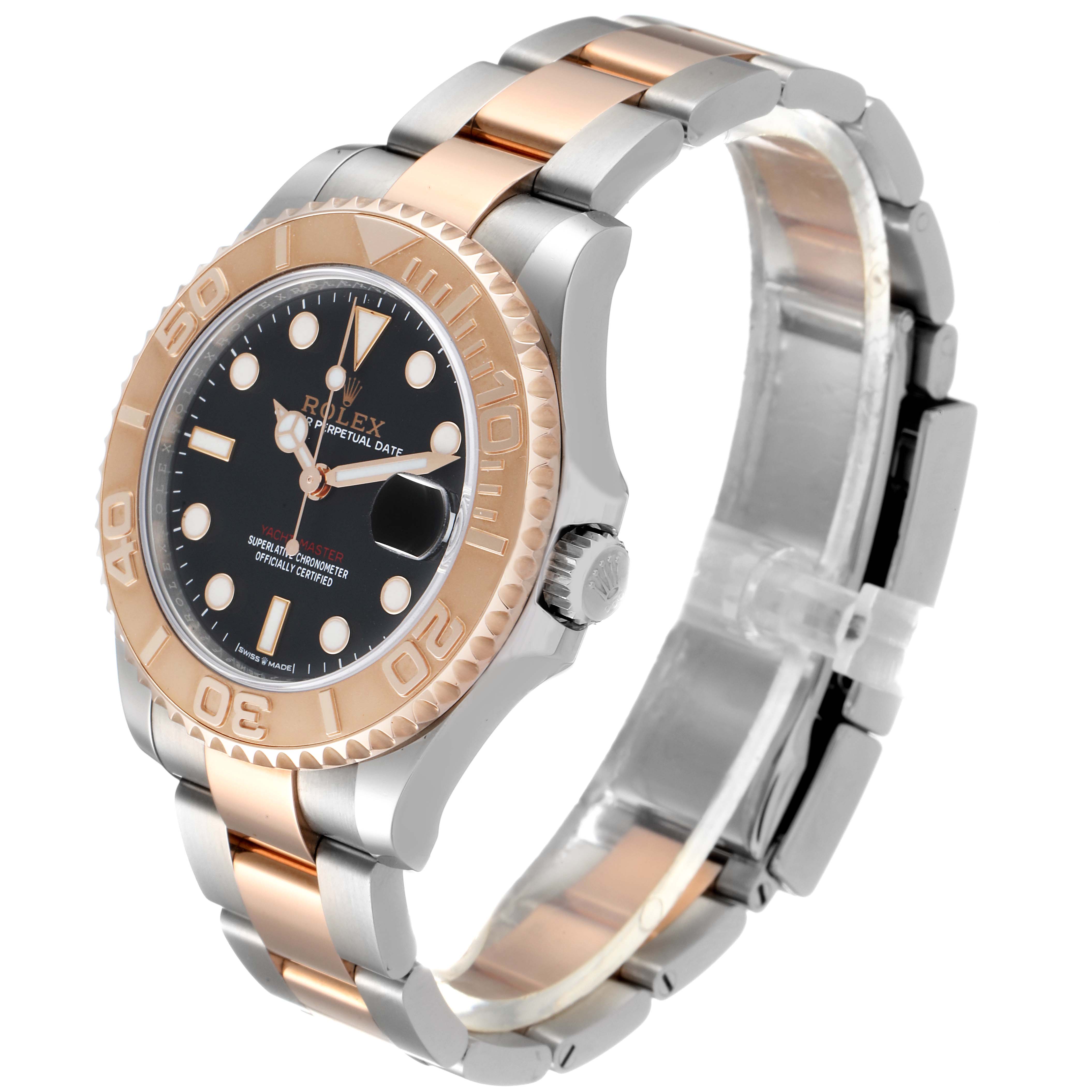 The Rolex Yacht-Master 268621 Men
s Steel and Gold (two tone) Black Dial 268621 Men
s Steel and Gold (two tone) Black Dial watch is shown at a three-quarter angle, highlighting its bezel, face, crown, and bracelet.