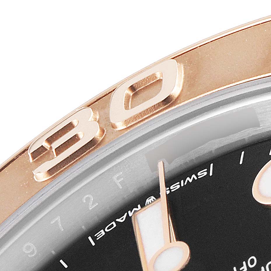 The image shows a close-up of the bezel and part of the dial of a Rolex Yacht-Master 268621 Men
s Steel and Gold (two tone) Black Dial 268621 Men
s Steel and Gold (two tone) Black Dial watch, highlighting the "30" marker and the "Swiss Made" text.