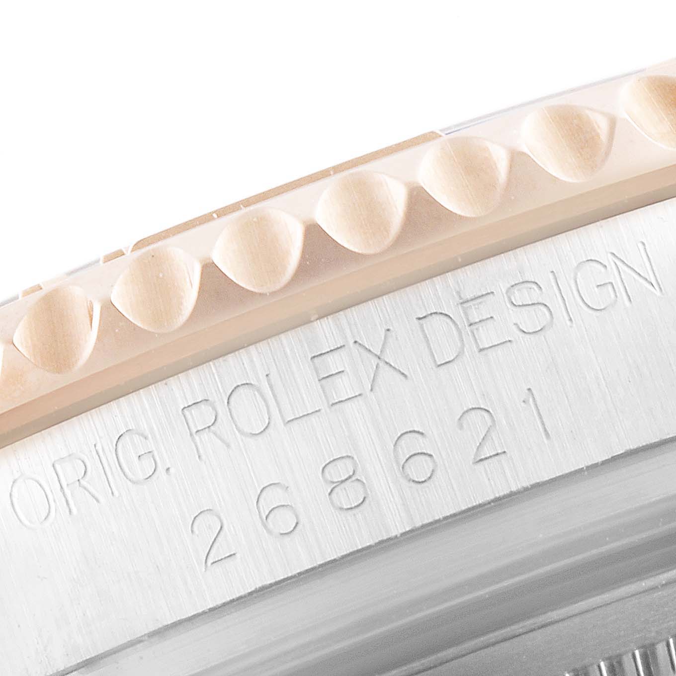 This close-up image shows a partial view of the bezel and case back of a Rolex Yacht-Master 268621 Men
s Steel and Gold (two tone) Black Dial 268621 Men
s Steel and Gold (two tone) Black Dial watch.