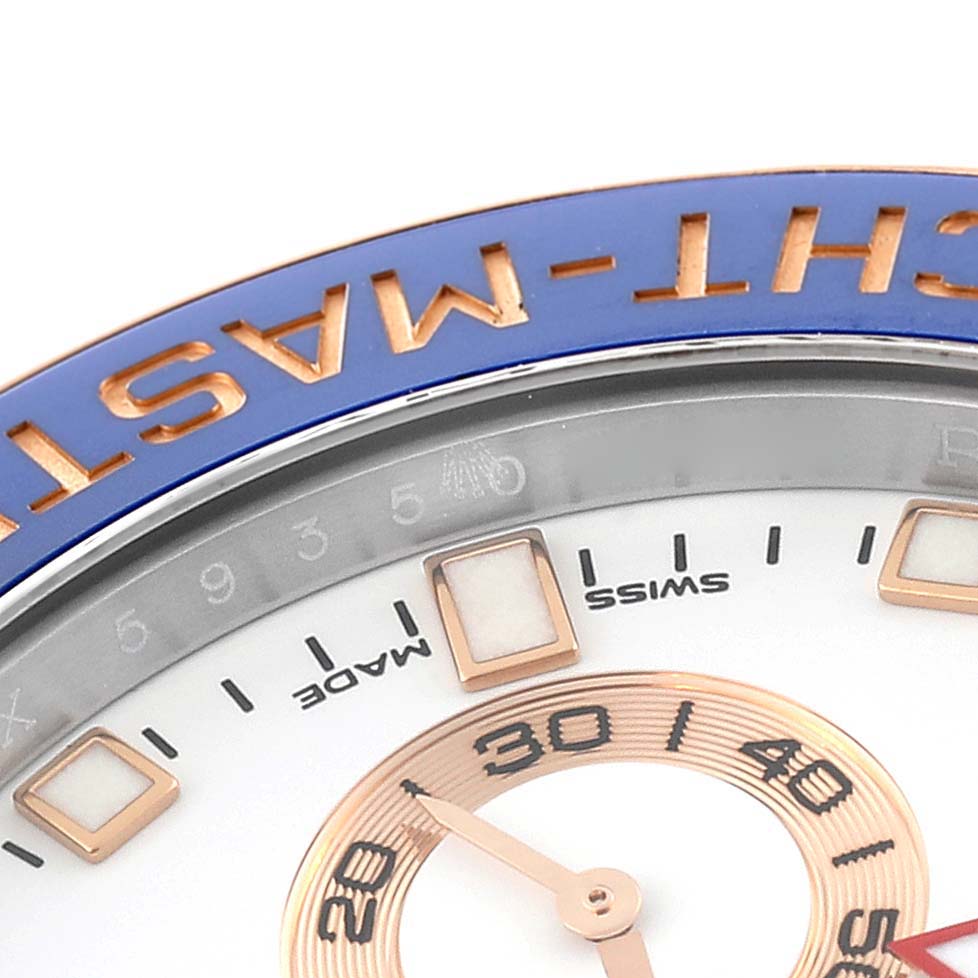 The image shows a close-up of the top left side of the dial and bezel of a Rolex Yacht-Master 116681 Men
s Steel and Gold (two tone) White Dial 116681 Men
s Steel and Gold (two tone) White Dial watch.