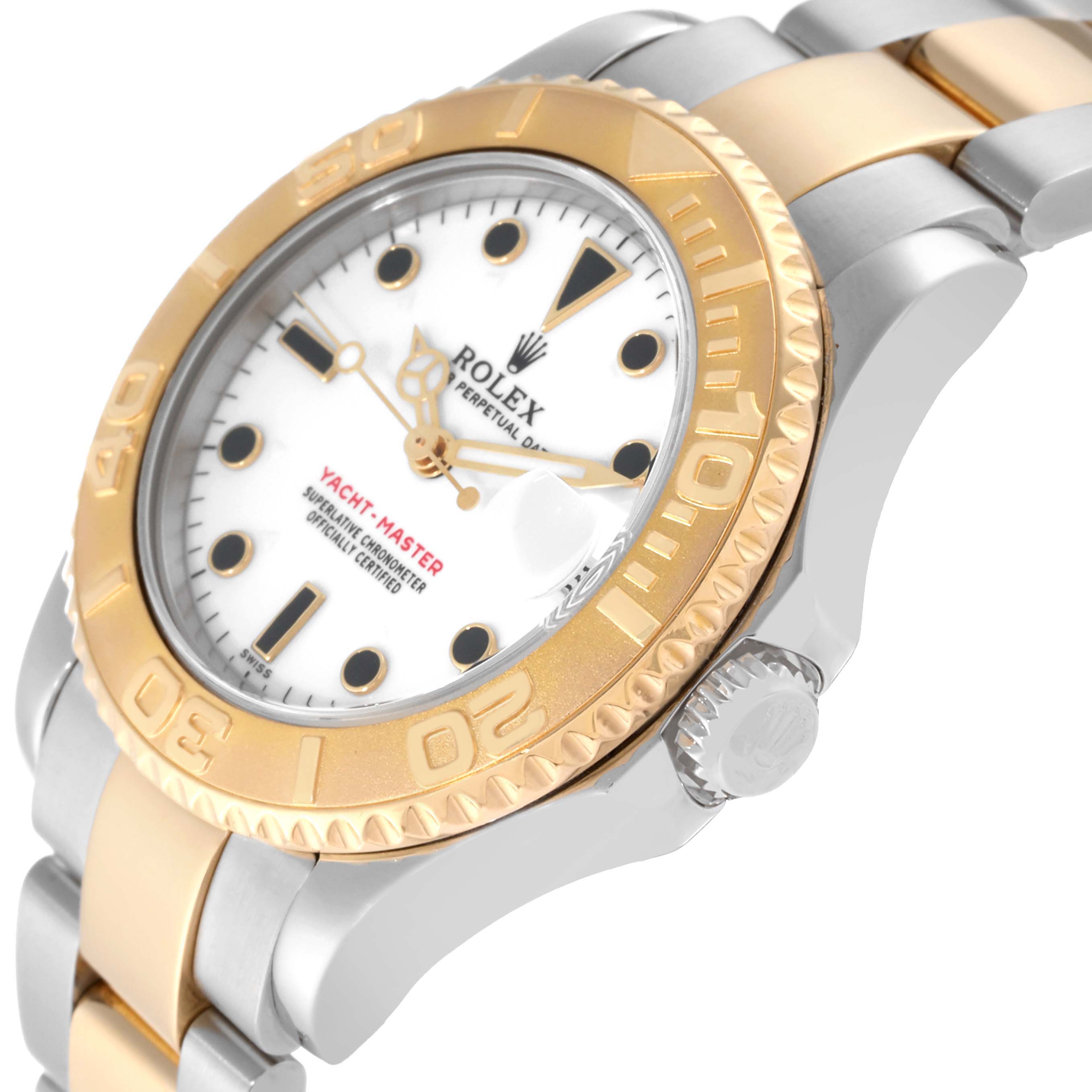 The image shows a close-up of the Rolex Yacht-Master 68623 Men's Steel and Gold (two tone) White Dial 68623 Men's Steel and Gold (two tone) White Dial watch, highlighting its bezel, dial, and part of the bracelet.