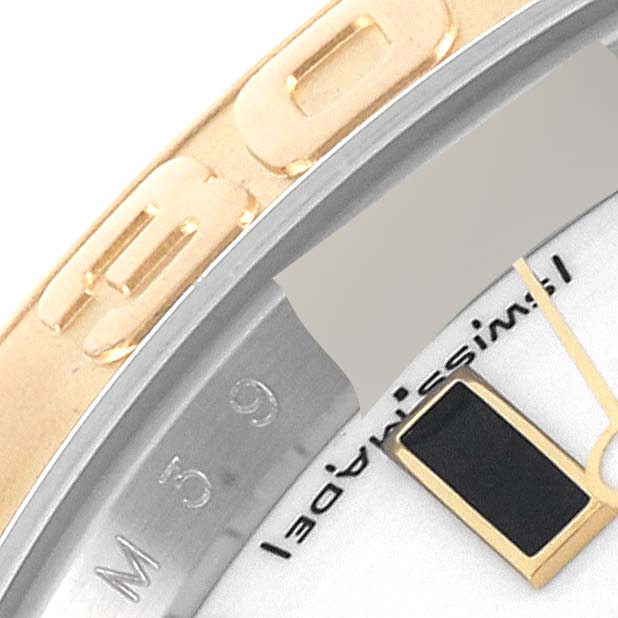 The image shows a close-up of the bezel and part of the face of a Yacht-Master model by Rolex.