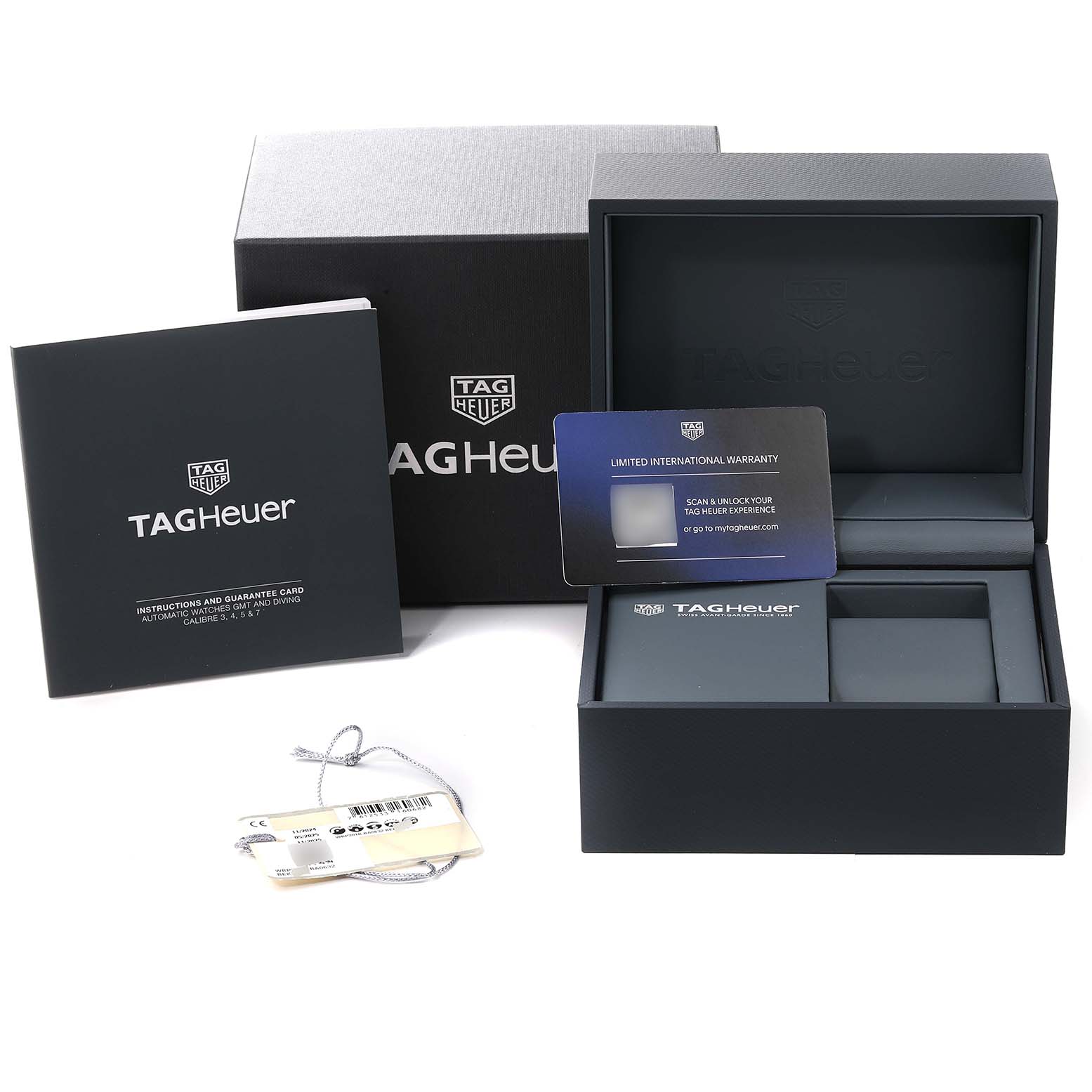 The image shows the packaging, warranty card, and instruction manual for a Tag Heuer Aquaracer WBP201B.BA0632 Men's Stainless Steel Blue Dial WBP201B.BA0632 Men's Stainless Steel Blue Dial watch.